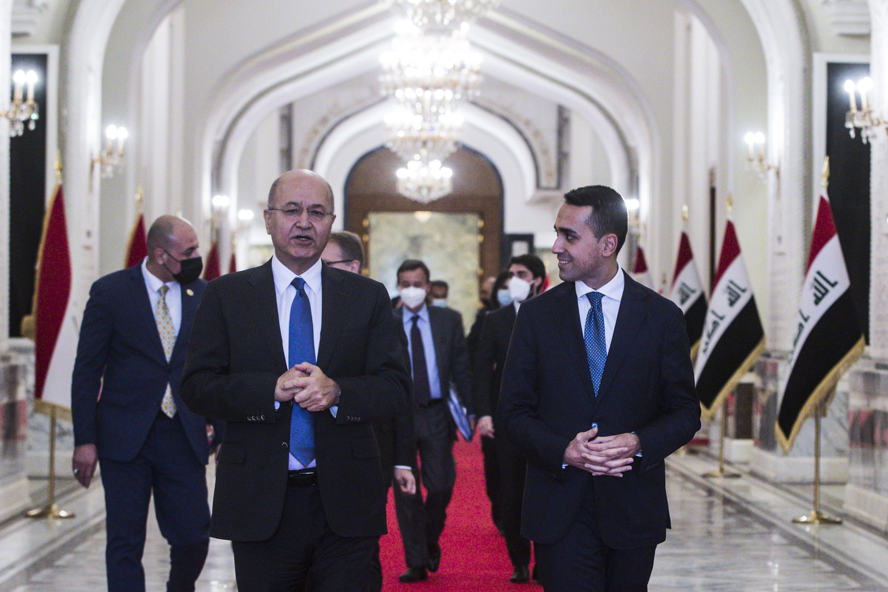 Italian Foreign Minister Luigi Di Maio (R) meets Iraqi President Barham Salih (L) during the mission to Baghdad, Iraq, 23 December 2021. Di Maio is on a two-day visit to Kuwait and Iraq to meet with officials and visit the Italian contingents at the Kuwait's Al Salem and Erbil's Camp Singara bases as well as the Italian soldiers of the NATO/CJTF contingent in Baghdad. EPA/ANGELO CARCONI

