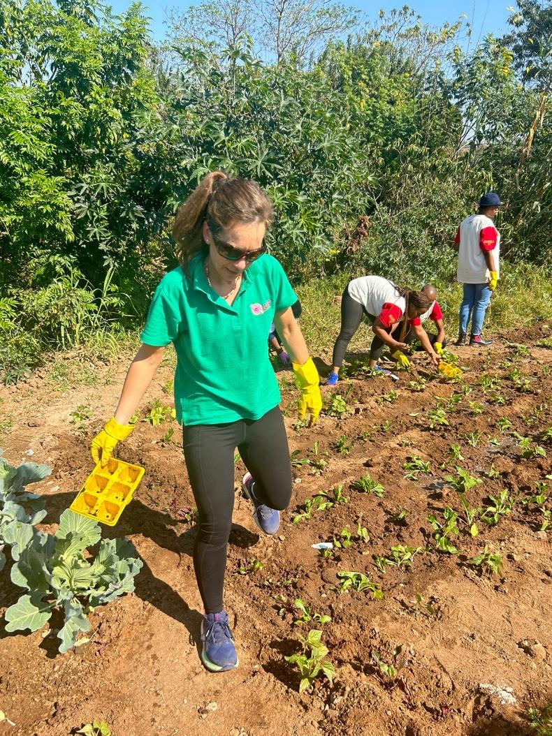 Tarryn Lokotsch at work in a garden at one of GRIP’s shelters in the Lowveld. Gardens are also started in survivors’ homes in the community. (Photo: Supplied)