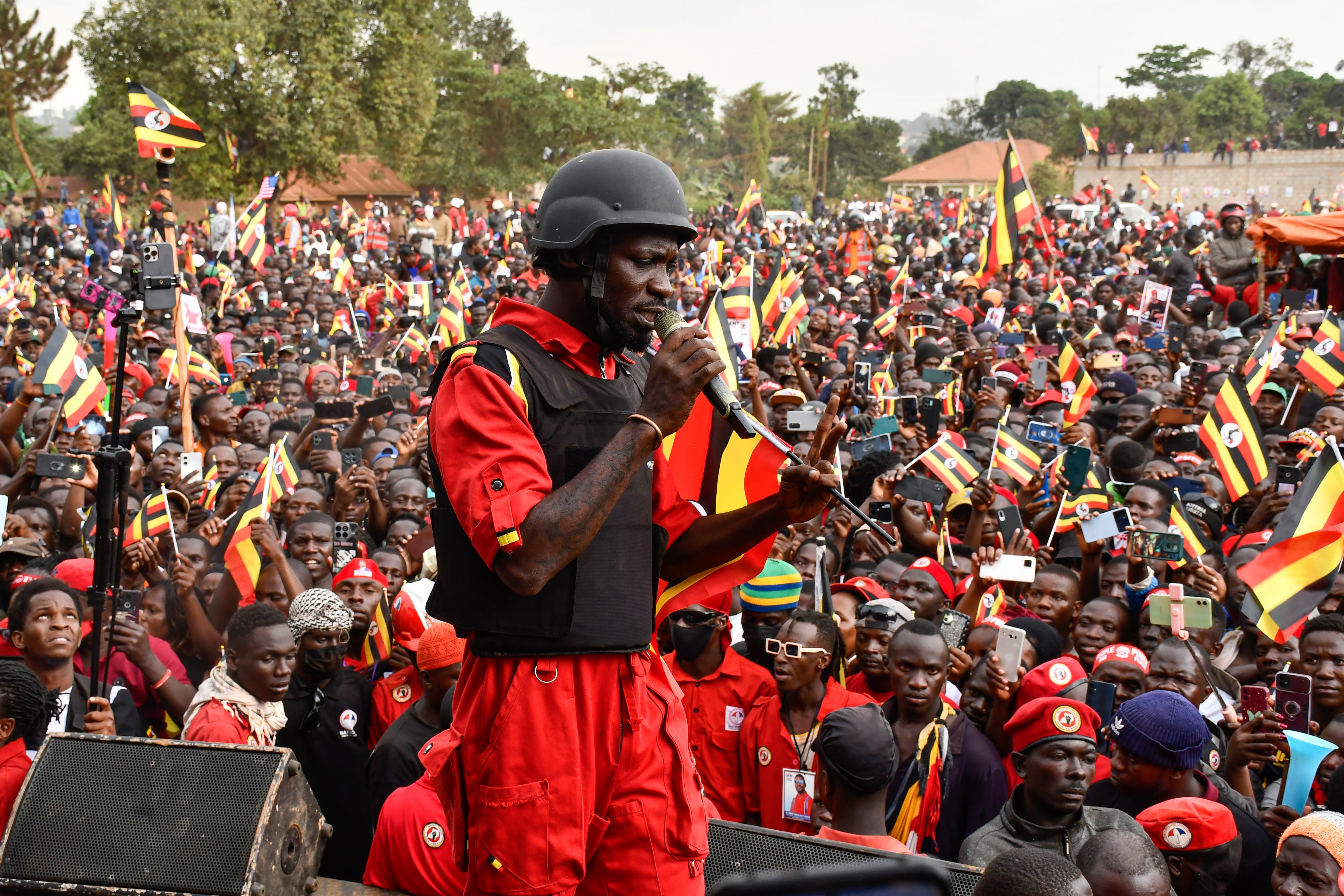 National Unity Platform (NUP) leader Robert Kyagulanyi, known as Bobi Wine (C), addresses his supporters during a campaign meeting near the Saint Joseph Primary School playing grounds in Nantabulirwa village, Mukono District, Uganda, 09 January 2026. Eight presidential candidates, including incumbent Yoweri Museveni and NUP candidate Bobi Wine, are contending in the presidential election scheduled for 15 January.  EPA/ISAAC KASAMANI