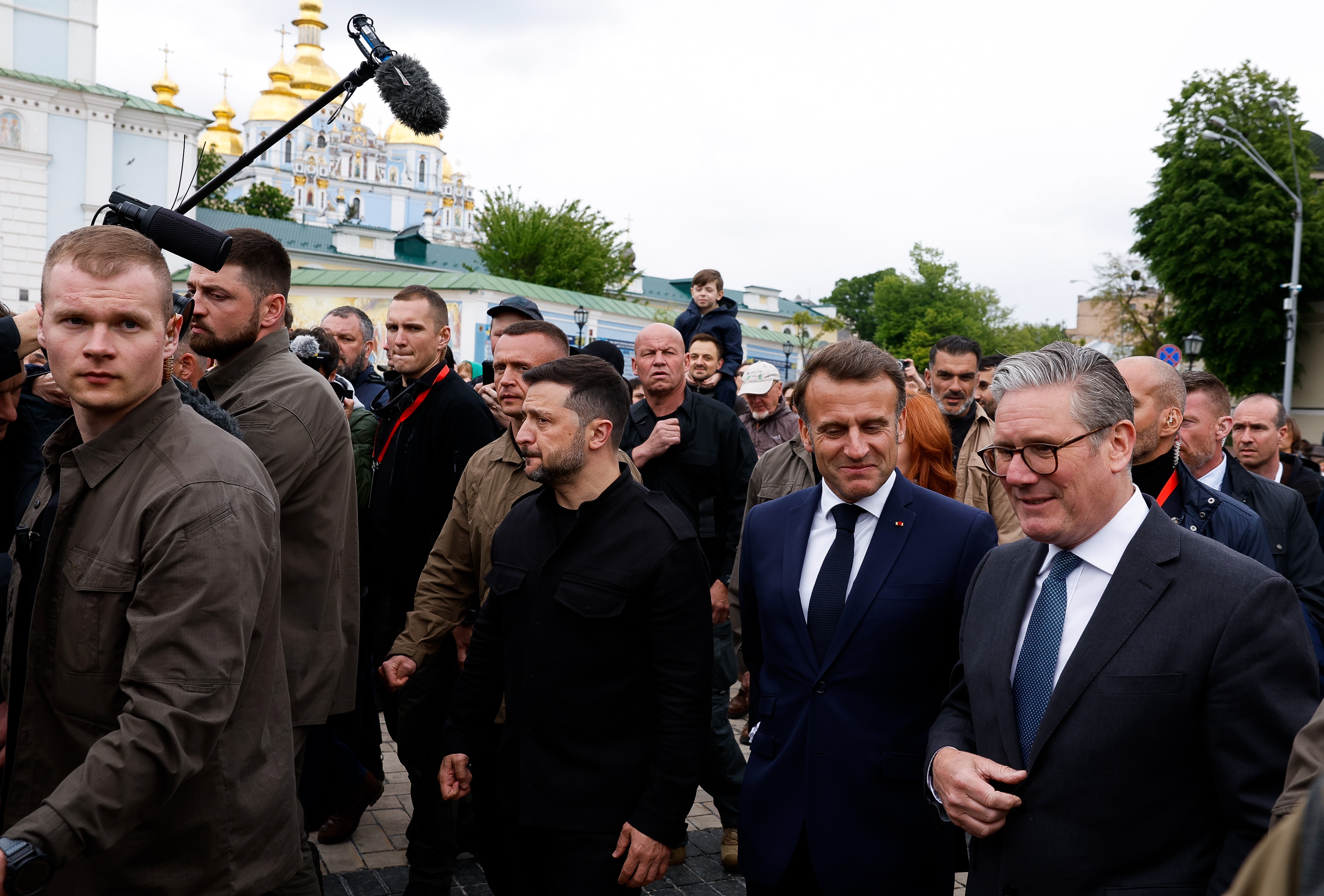 Ukrainian President Volodymyr Zelenskiy (C), French President Emmanuel Macron (2-R) and British Prime Minister Keir Starmer (R) walk as St. Michael's Golden-Domed Monastery is seen in the background, following a meeting of the 'Coalition of the willing' at the Mariinskyi Palace, the official residence of the president of Ukraine, in Kyiv, Ukraine, 10 May 2025, amid the ongoing Russian invasion.  EPA/THOMAS PETER / POOL