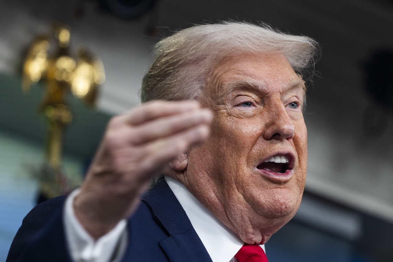 US President Trump speaks on to reporters ahead of trip to Davos