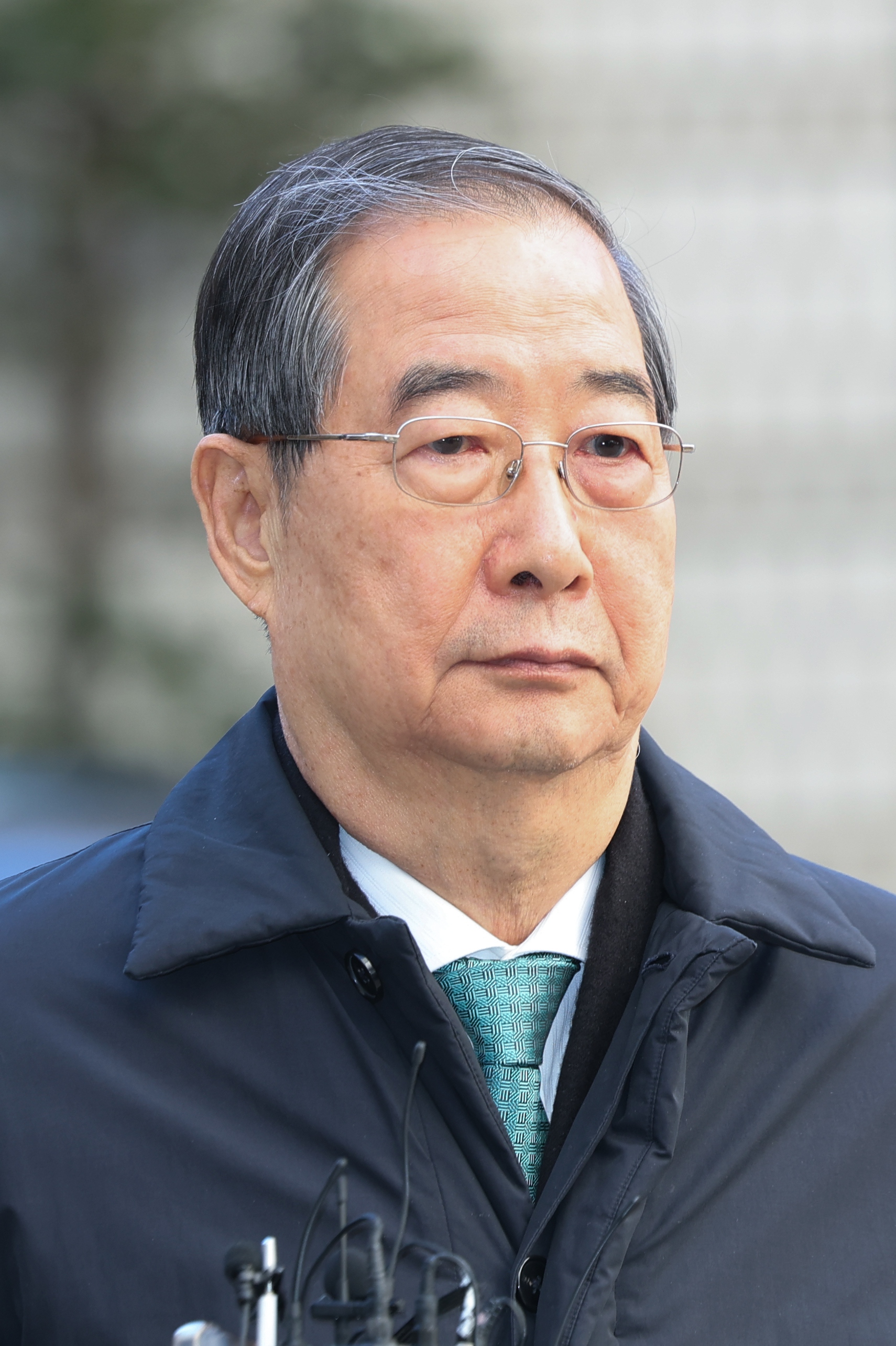 Former Prime Minister Han Duck-soo appears at the Seoul Central District Court in Seoul, South Korea, 21 January 2026, to hear the verdict for his trial on charges he played a key role in an insurrection by abetting former President Yoon Suk Yeol's failed imposition of martial law. The court sentenced Han to 23 years in prison.  EPA/YONHAP SOUTH KOREA OUT