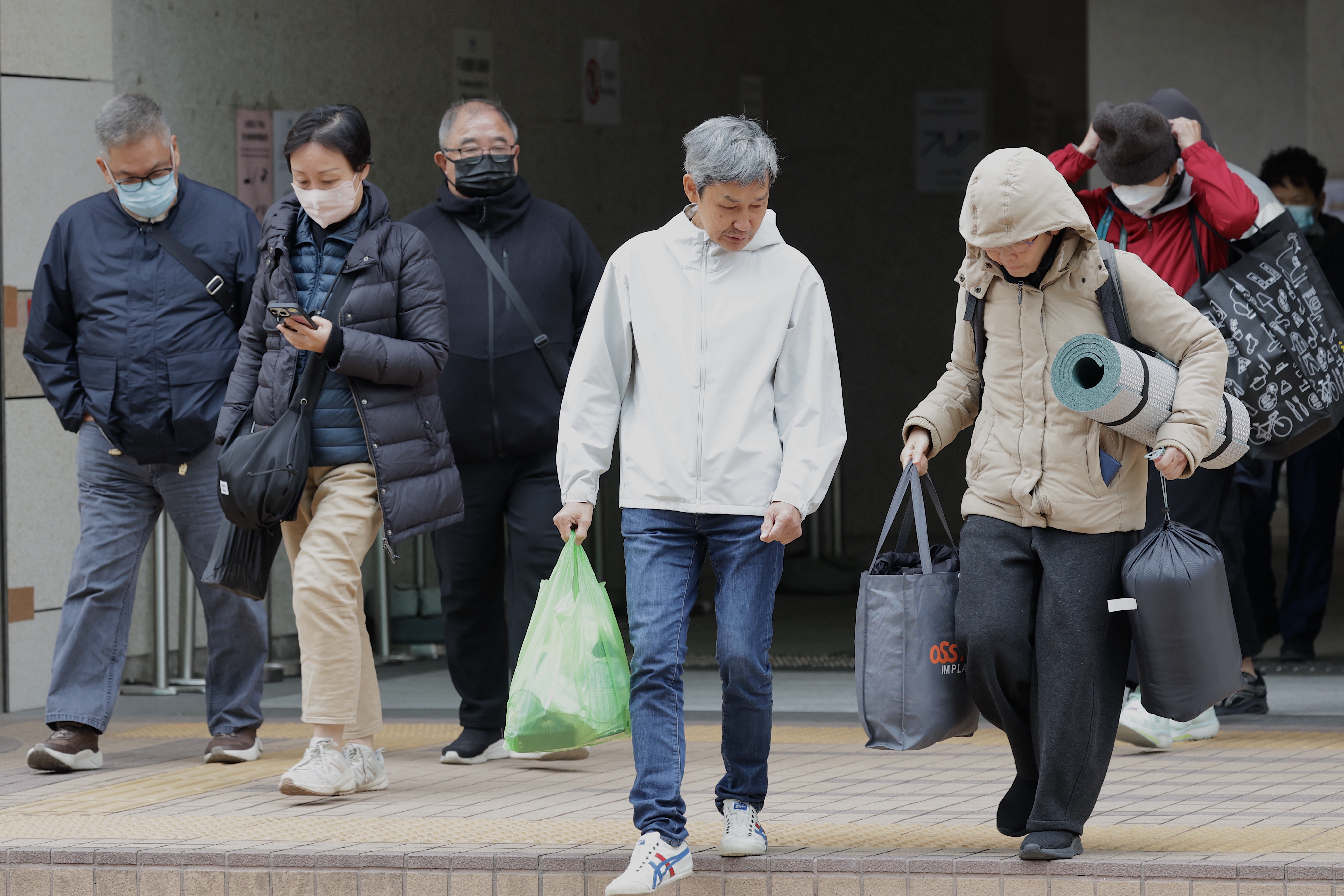 Members of the public leaves the West Kowloon Law Courts Building, sitting as the High Court, following the scheduled opening of the national security trial of the now-disbanded Hong Kong Alliance in Support of Patriotic Democratic Movements of China in Hong Kong, China, 22 January 2026. The Alliance, along with its former chairperson and vice-chairpersons ? Chow Hang-Tung, Lee Cheuk-Yan and Albert Ho Chun-Yan ? are charged with inciting subversion of state power under the Beijing-imposed national security law. The three former leaders were arrested in 2021, and the Alliance later disbanded. The case examines whether the organization?s long-standing political platform and annual commemorations of the 04 June 1989 Tiananmen crackdown amount to subversion.  EPA/MAY JAMES