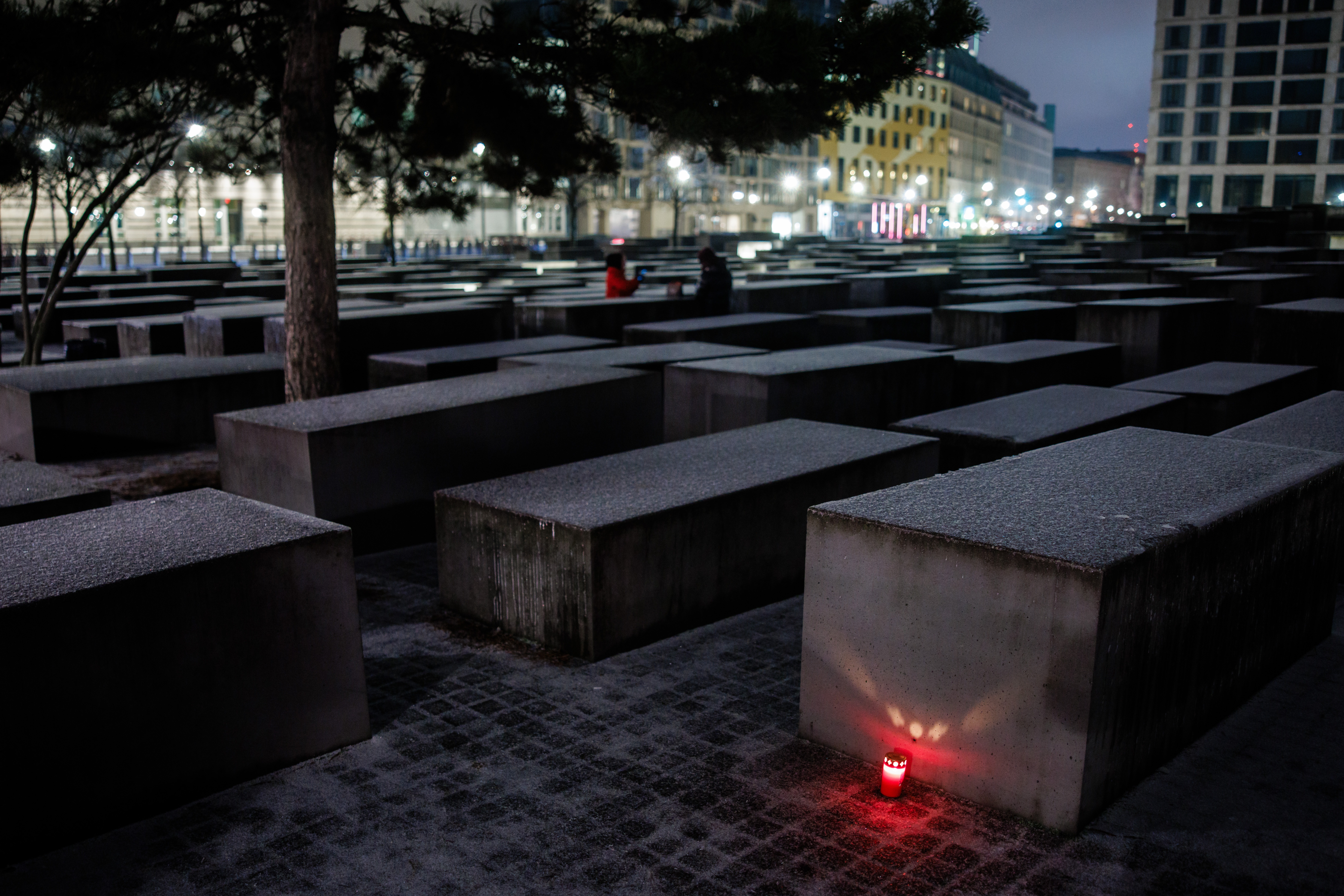 A candle stands in front of a stele of the so called Holocaust Memorial, the Memorial to the Murdered Jews of Europe, in Berlin, Germany, 26 January 2026. The International Holocaust Remembrance Day takes place on 27 January on a yearly basis.  EPA/CLEMENS BILAN