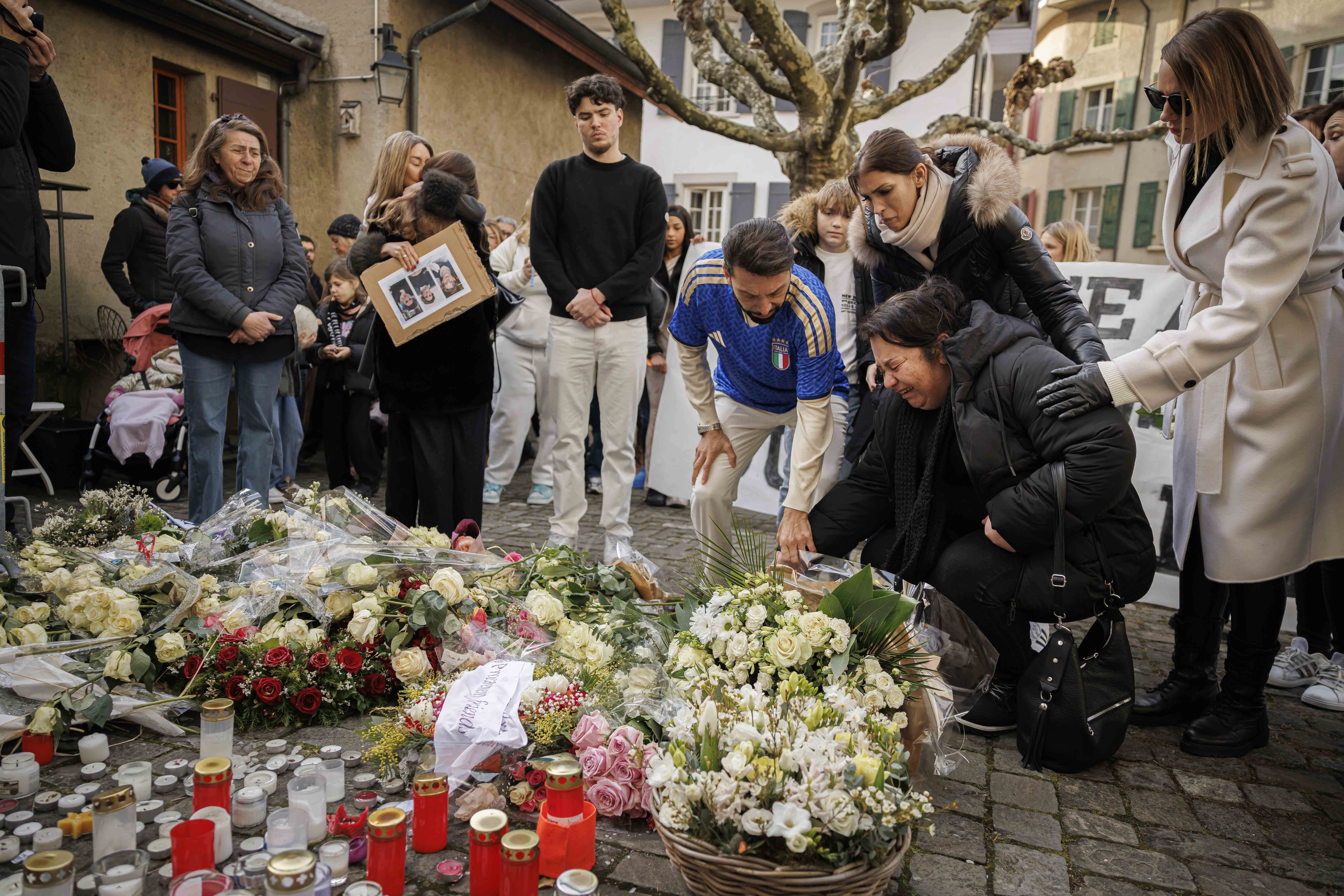 Parents of victims bring flowers as about a thousand people gather to pay tribute to the victims of the tragedy in Crans-Montana and to call for justice and truth, Lutry, Switzerland, 31 January 2026. 40 people, mostly teenagers, lost their lives and 116 were severely injured in the fire at the bar Le Constellation during the New Year?s celebration in the Swiss Alps resort of Crans-Montana.  EPA/VALENTIN FLAURAUD