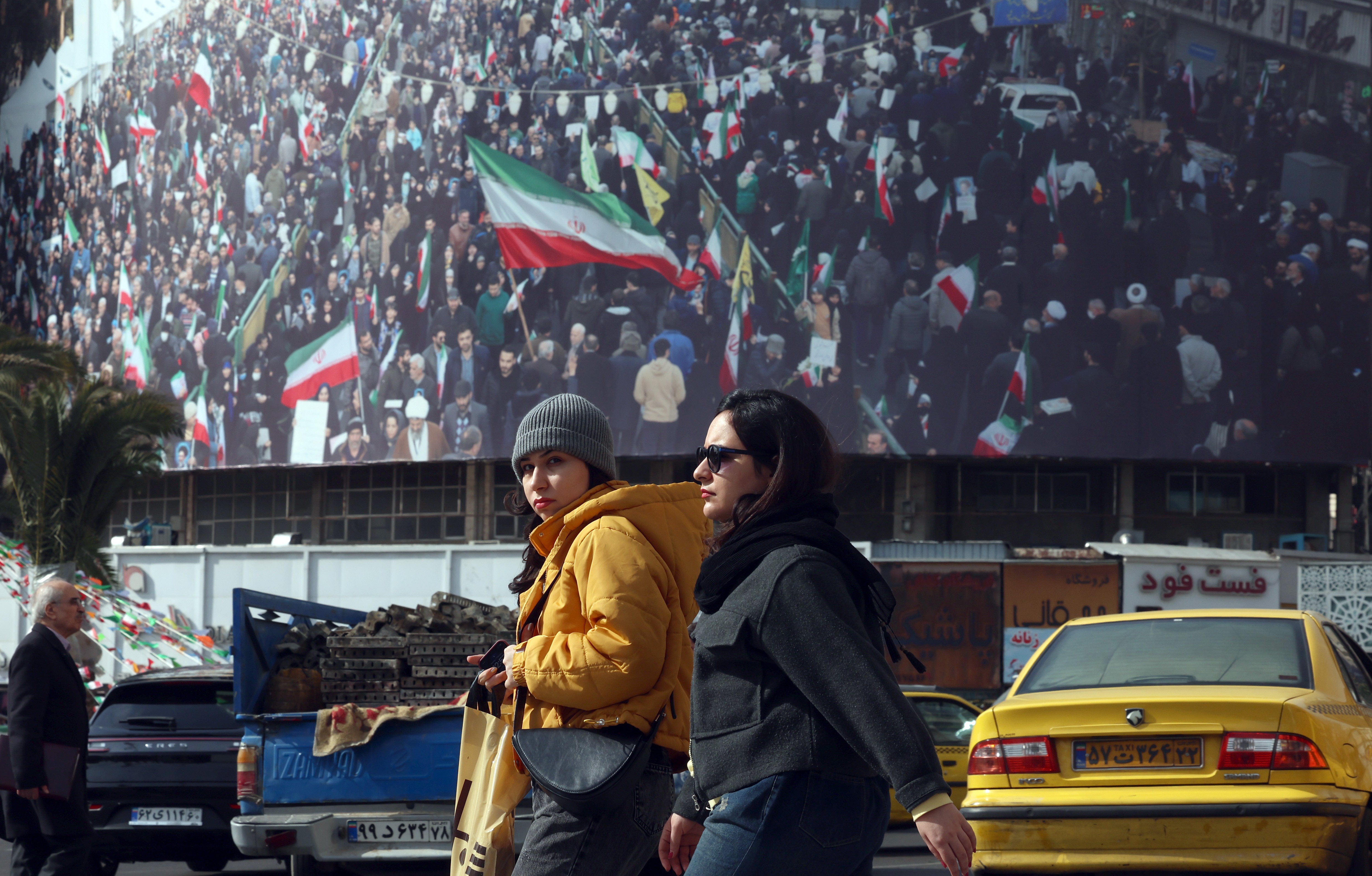 Iranians walk in a street in Tehran, Iran, 02 February 2026. Following the US President Donald Trump renewed threats of military action against Iran, Iranian supreme leader Ayatollah Ali Khamenei on 01 February 2026 warned that any military attack by the United States would spark a 'regional war'.  EPA/ABEDIN TAHERKENAREH