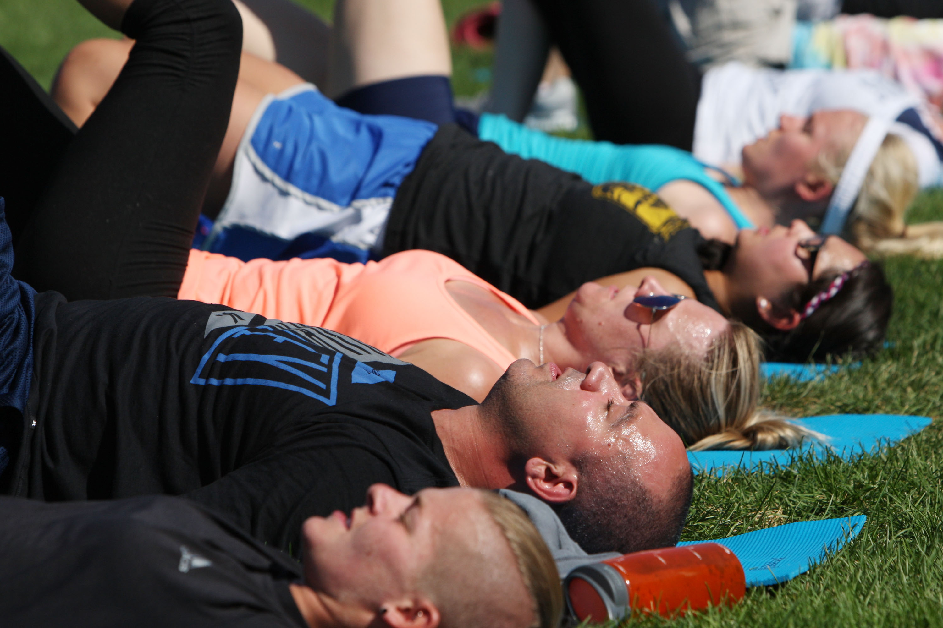 Participants sweat while taking part in the yoga workout. (Photo: Jason Bahr/Getty Images)