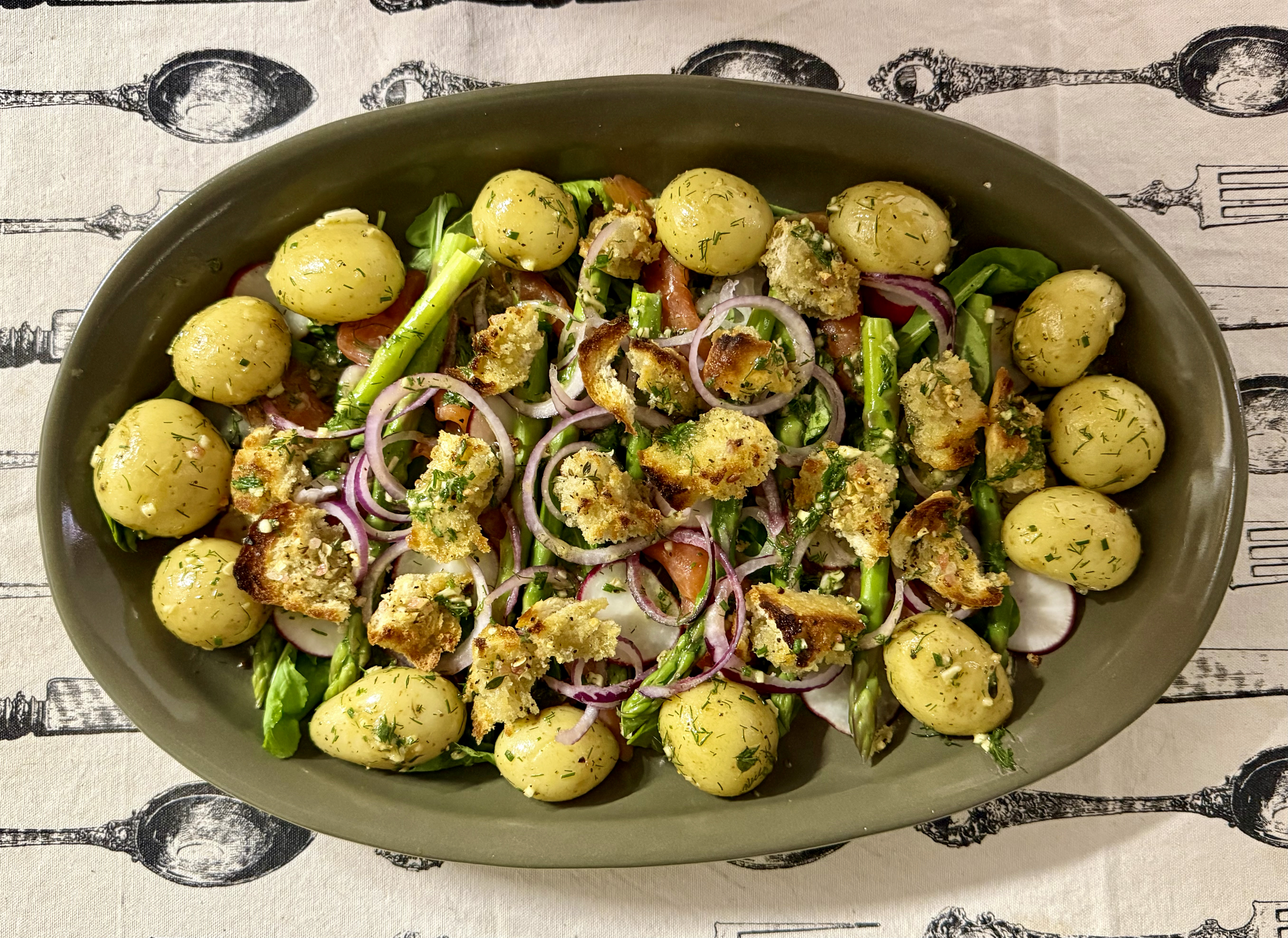 Tony Jackman’s salad of smoked salmon, asparagus and baby potatoes with rocket, radish, dill, chives and garlicky chunks of toasted sourdough. (Photo: Tony Jackman)