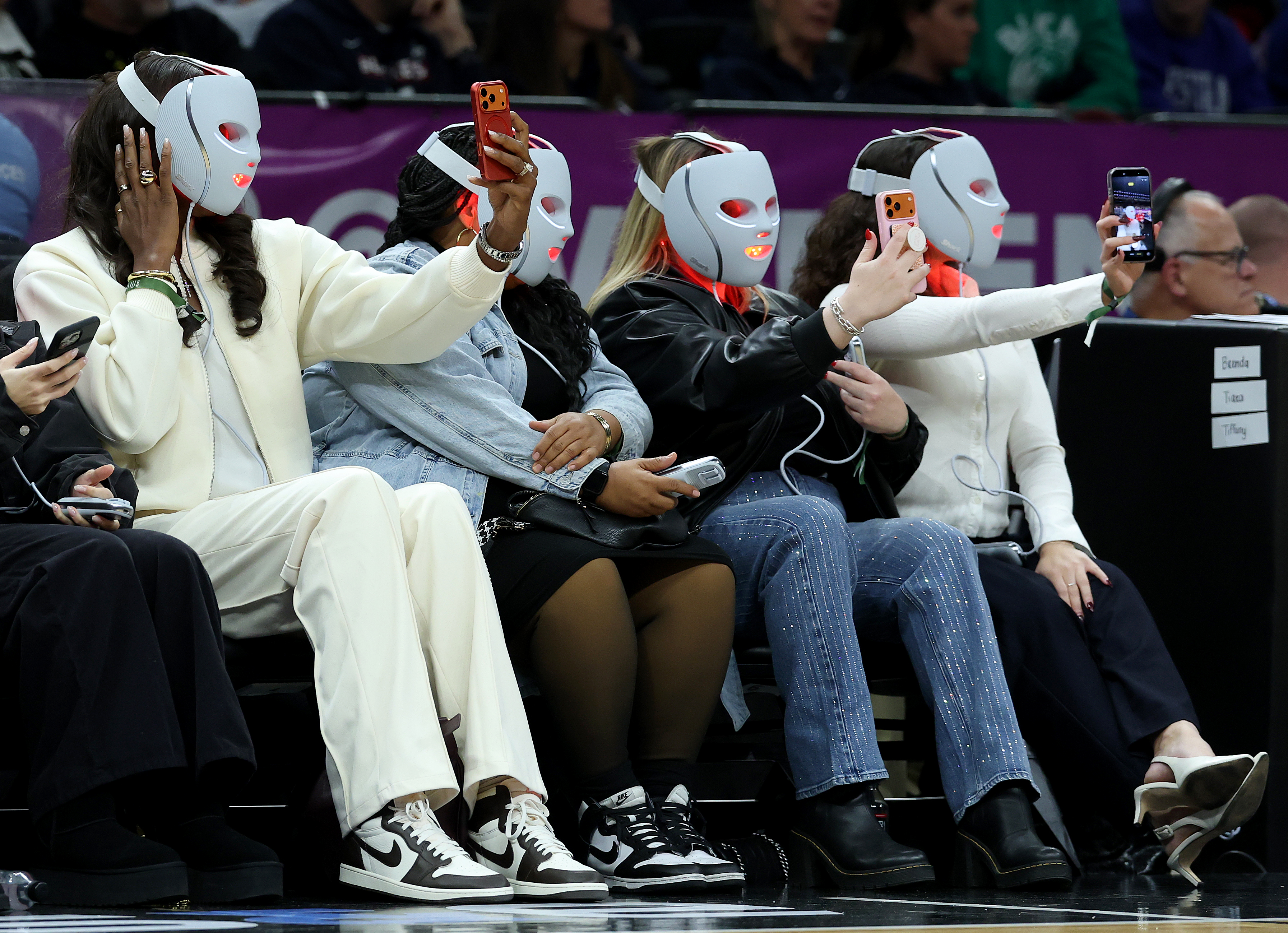 WNBA legend Lisa Leslie and the rest of the section wear the Shark Beauty LED light therapy mask during the 2025 Women's Champions Classic at Barclays Centre on December 20, 2025 in the Brooklyn borough of New York City. (Photo by Elsa/Getty Images)