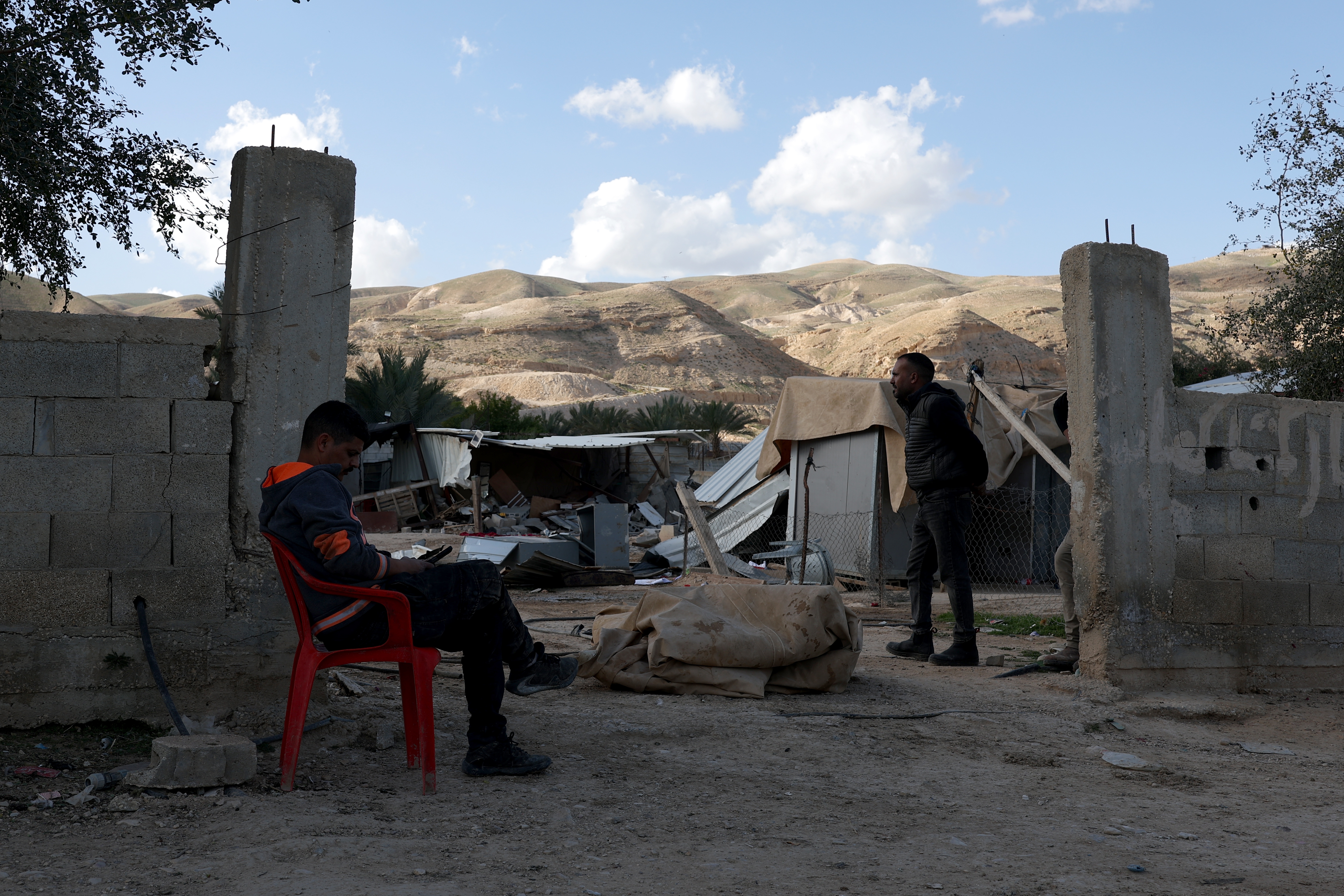 Bedouin men inspect the damage at their houses in Istih Al-Dyouk Al-Tahta, a suburb of the  West Bank city of Jericho, 11 February 2026, a day after they were demolished by Israeli settlers. They demolished 12 houses and eight properties, displacing about 60 Istih Al-Dyouk Al-Tahta community members, Rashid Yousef Al-Ma'ina said.  EPA/ATEF SAFADI
