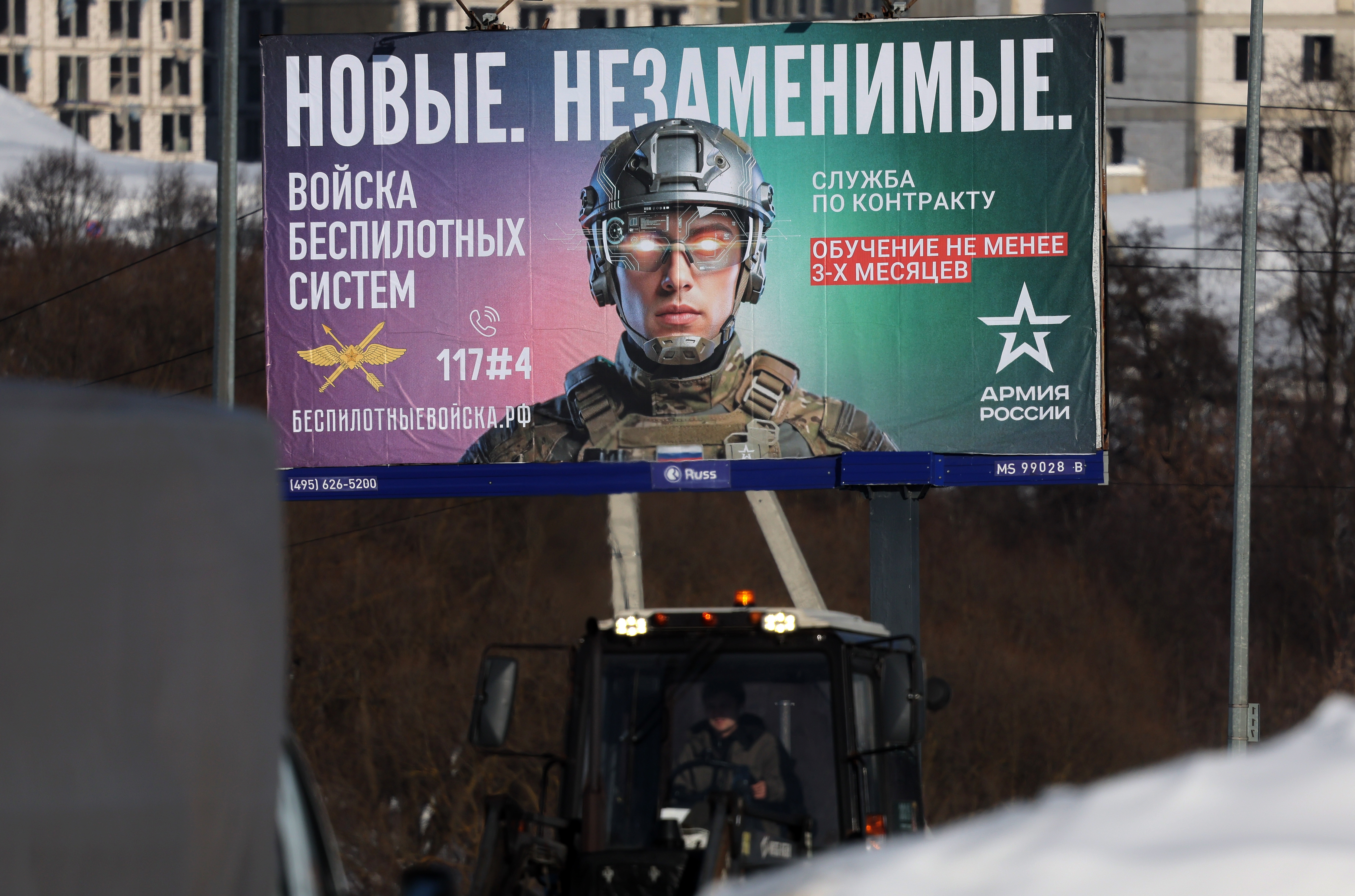 A billboard on a street with an image of a Russian soldier, advertising contract military service in new created Russian unmanned systems Forces, during a sunny winter day in Moscow, Russia, 17 February 2026.  EPA/MAXIM SHIPENKOV