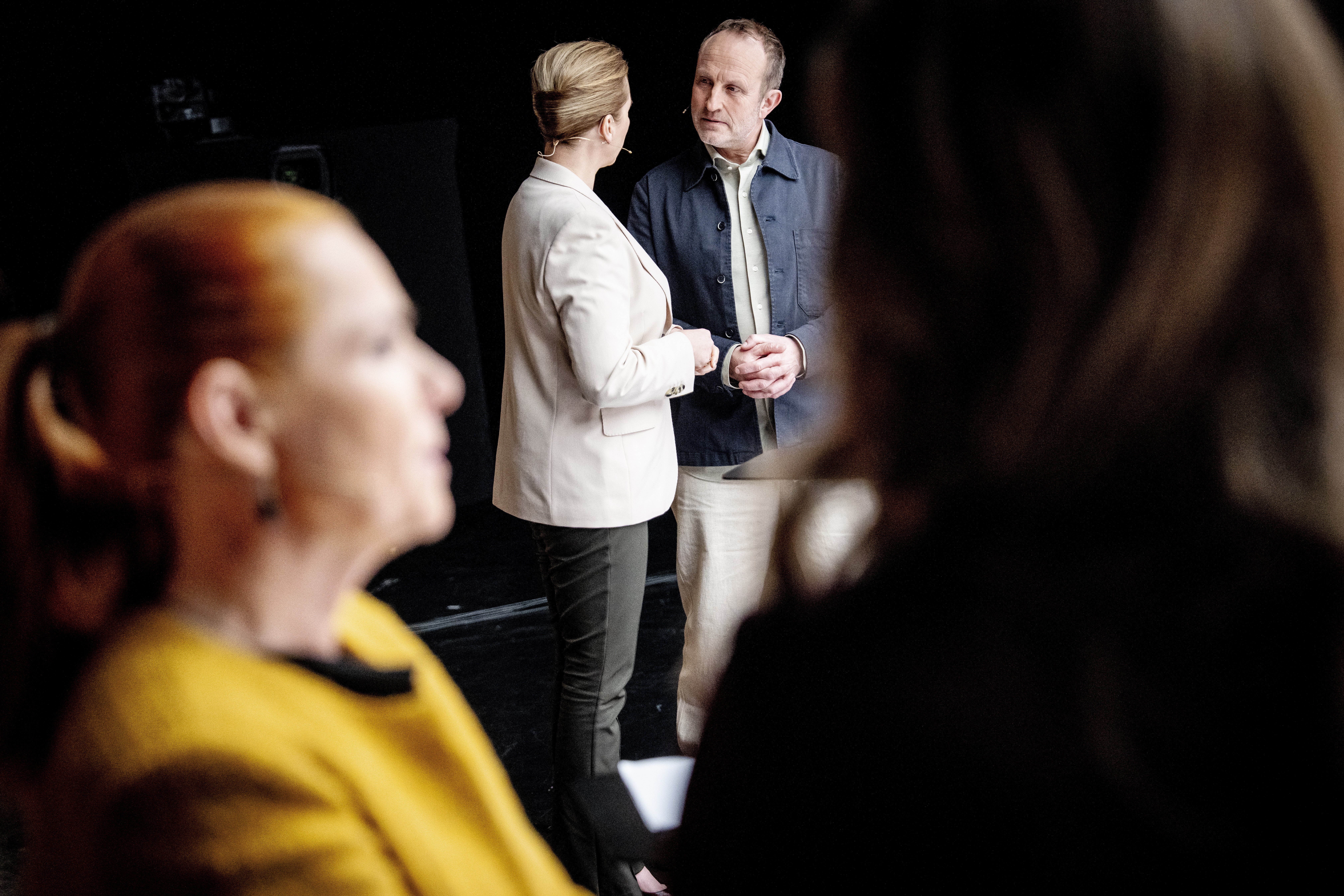 Danish Prime Minister and Social Democrats leader Mette Frederiksen (C-L) talks to Danish Social Liberal Party leader Martin Lidegaard (C-R) before a party leader debate hosted by DR (Danmarks Radio) in Copenhagen, Denmark, 26 February 2026. Danish Prime Minister Frederiksen called for a snap general election to be held on 24 March 2026.  EPA/MADS CLAUS RASMUSSEN  DENMARK OUT