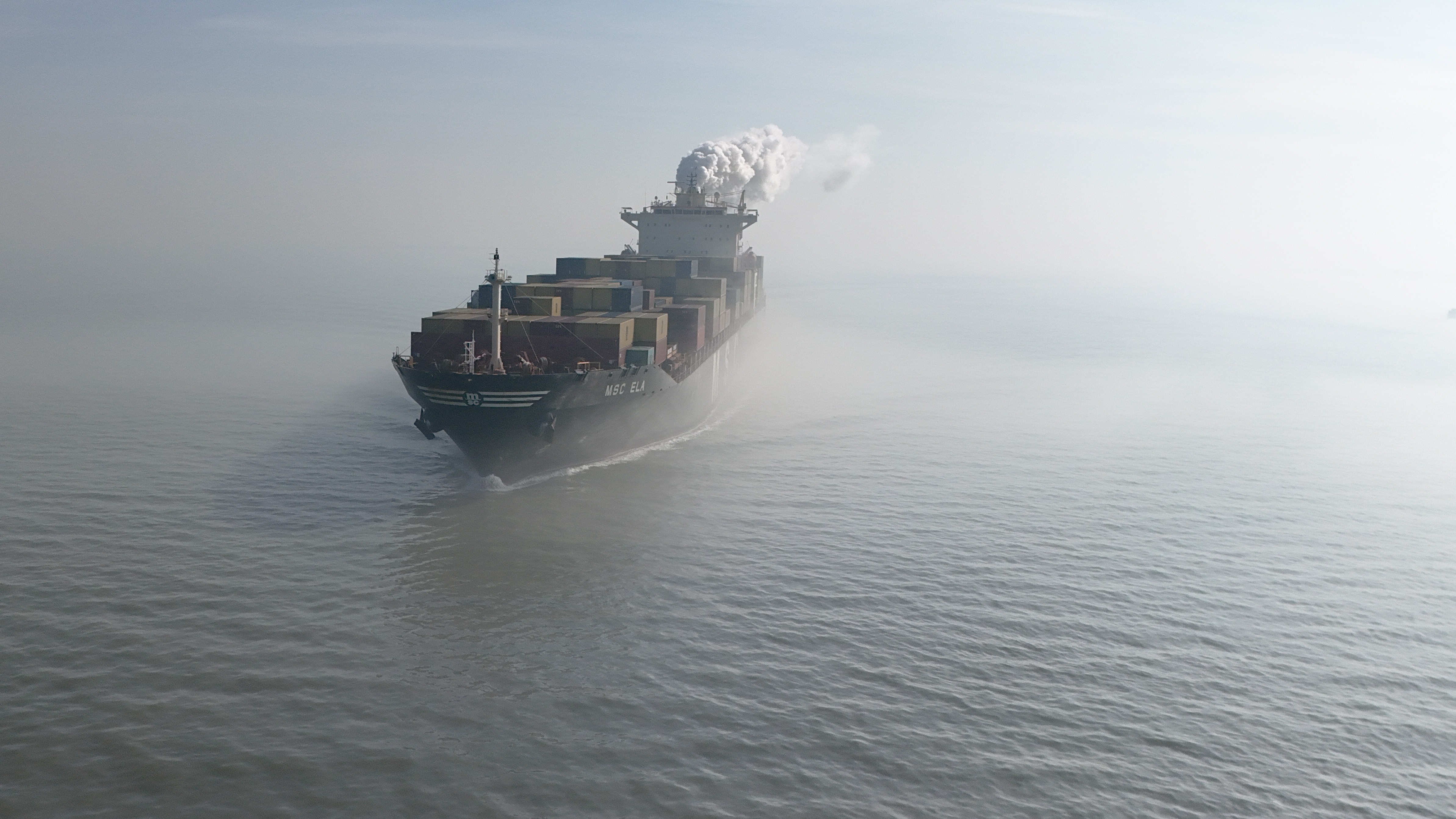 A drone image shows an aerial view of MSC Ela registered in Panama (IMO 9282259) leaving   Antwerp harbour, near Hansweert, the Netherlands, 04 March 2026. The EU Commission is to present EU Industrial Maritime and Port Strategies, following the closure of the Strait of Hormuz amid the escalating regional conflict leading to growing concern over global oil supplies.  EPA/OLIVIER HOSLET