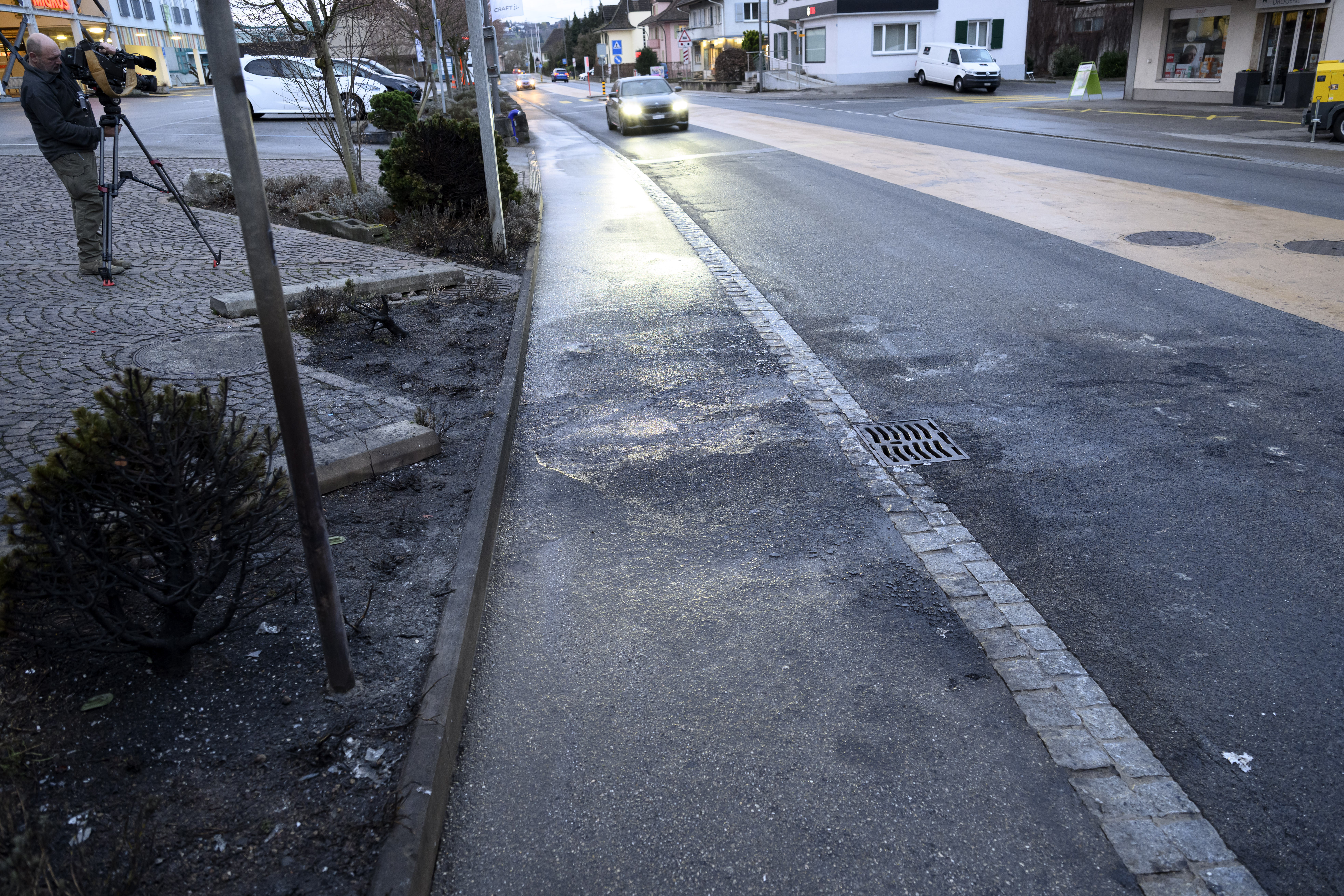 The spot where a postal bus caught fire is pictured in the center of Kerzers, Switzerland, 11 March 2026. According to the Fribourg cantonal police, six people were killed and four others injured when the bus went up in flames in the late afternoon on 10 March.  EPA/LAURENT GILLIERON