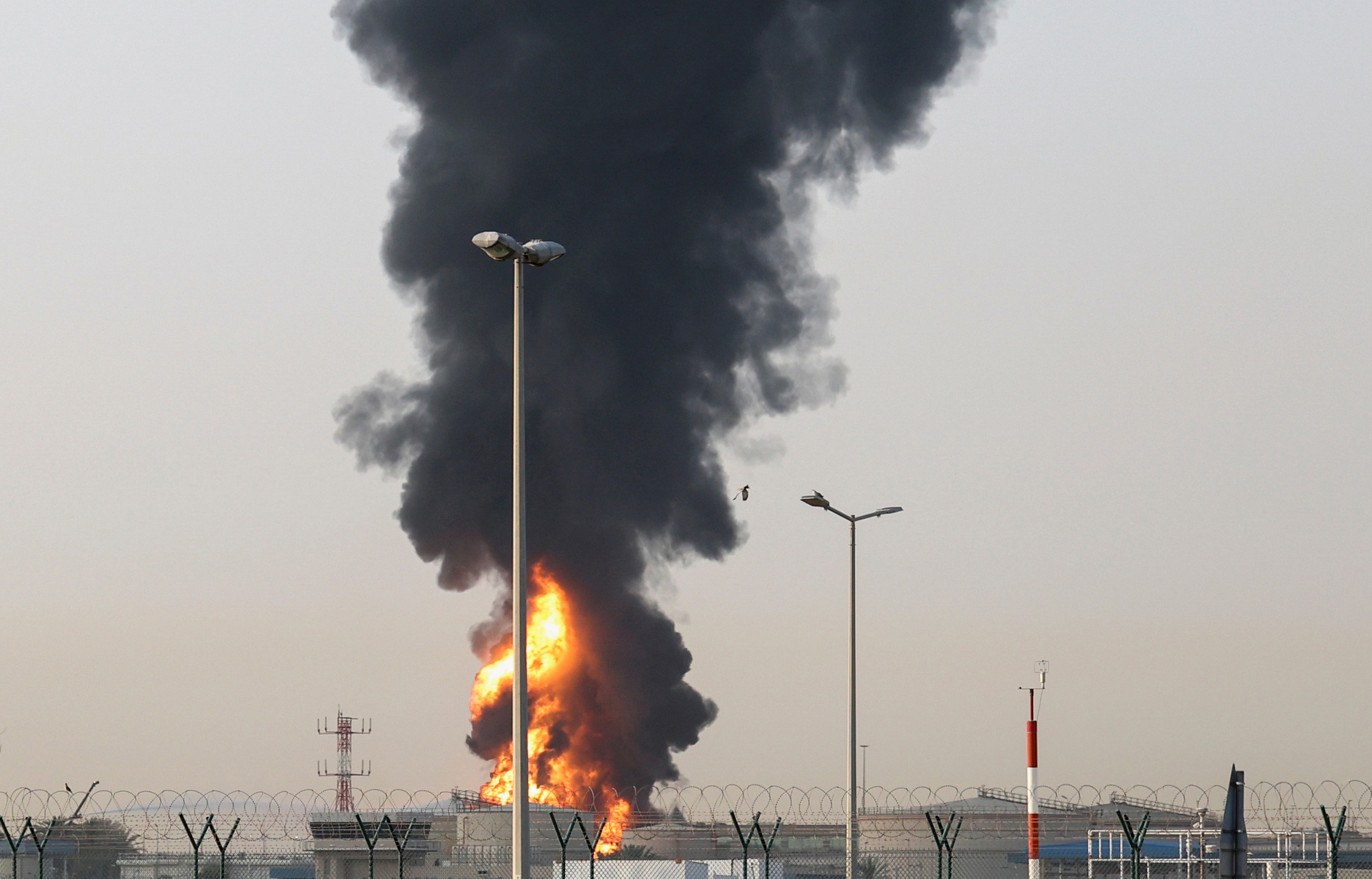 Smoke rises from an area near Dubai International Airport (DXB) in Dubai, United Arab Emirates, 16 March 2026, amid the US-Israel conflict with Iran. The Dubai Media Office reported a 'drone incident' in the vicinity of the airport that affected a fuel tank, igniting a large fire. Authorities temporarily suspended all flights at the airport as a precautionary measure; no injuries have been reported. Civil defense teams successfully contained the fire by morning.  EPA/STRINGER