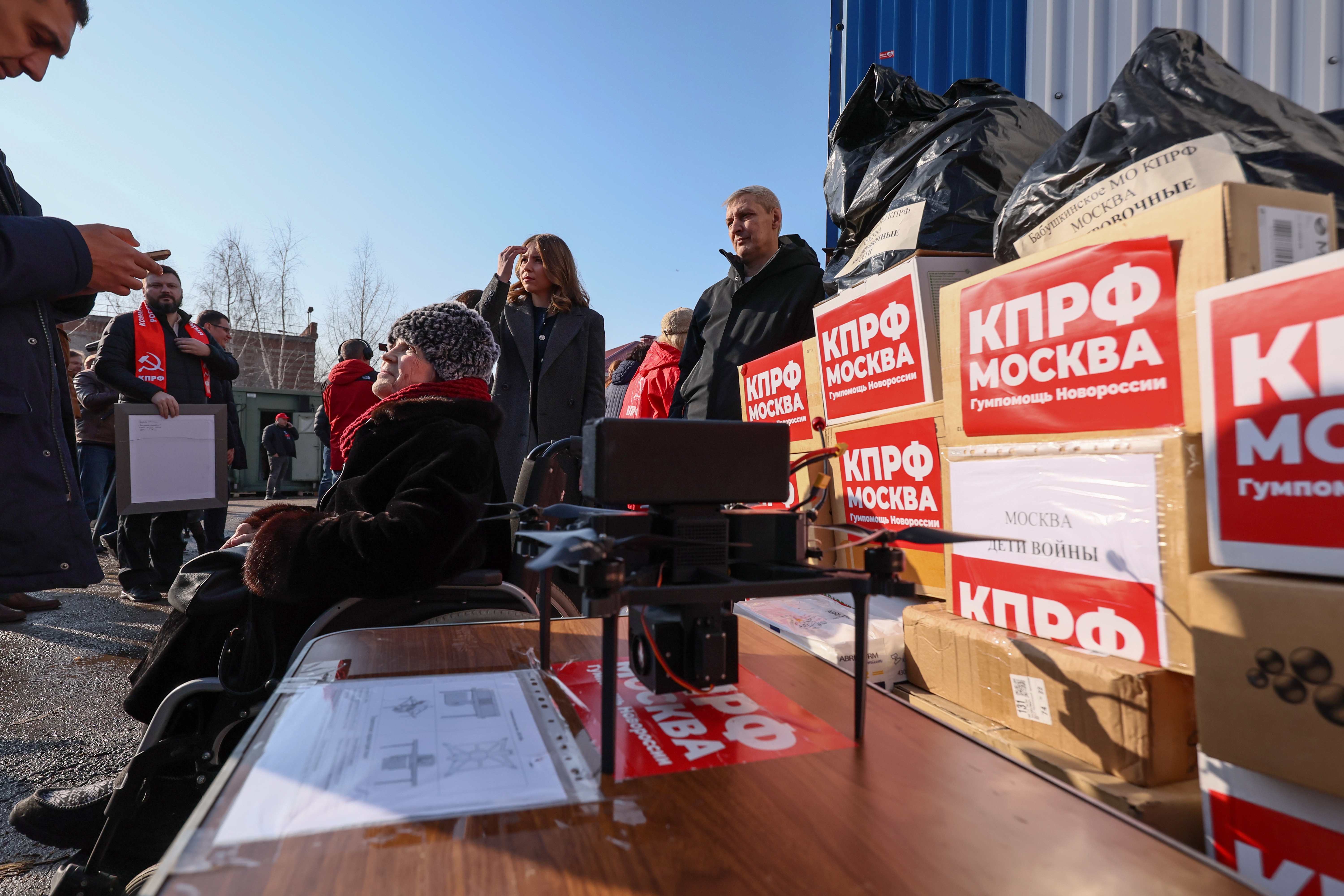 Russian Communist Party (CPRF) supporters prepare to send off the 151st humanitarian convoy at the Lenin State Farm outside Moscow, Russia, 16 March 2026. The convoy, organized by the Russian Communist Party and destined for the Russian army and residents of the Kursk, Donetsk, and Luhansk regions, will deliver long-life products such as cereals and canned goods, medicines, warm clothing, and special equipment including SUVs and motorcycles.  EPA/SERGEI ILNITSKY
