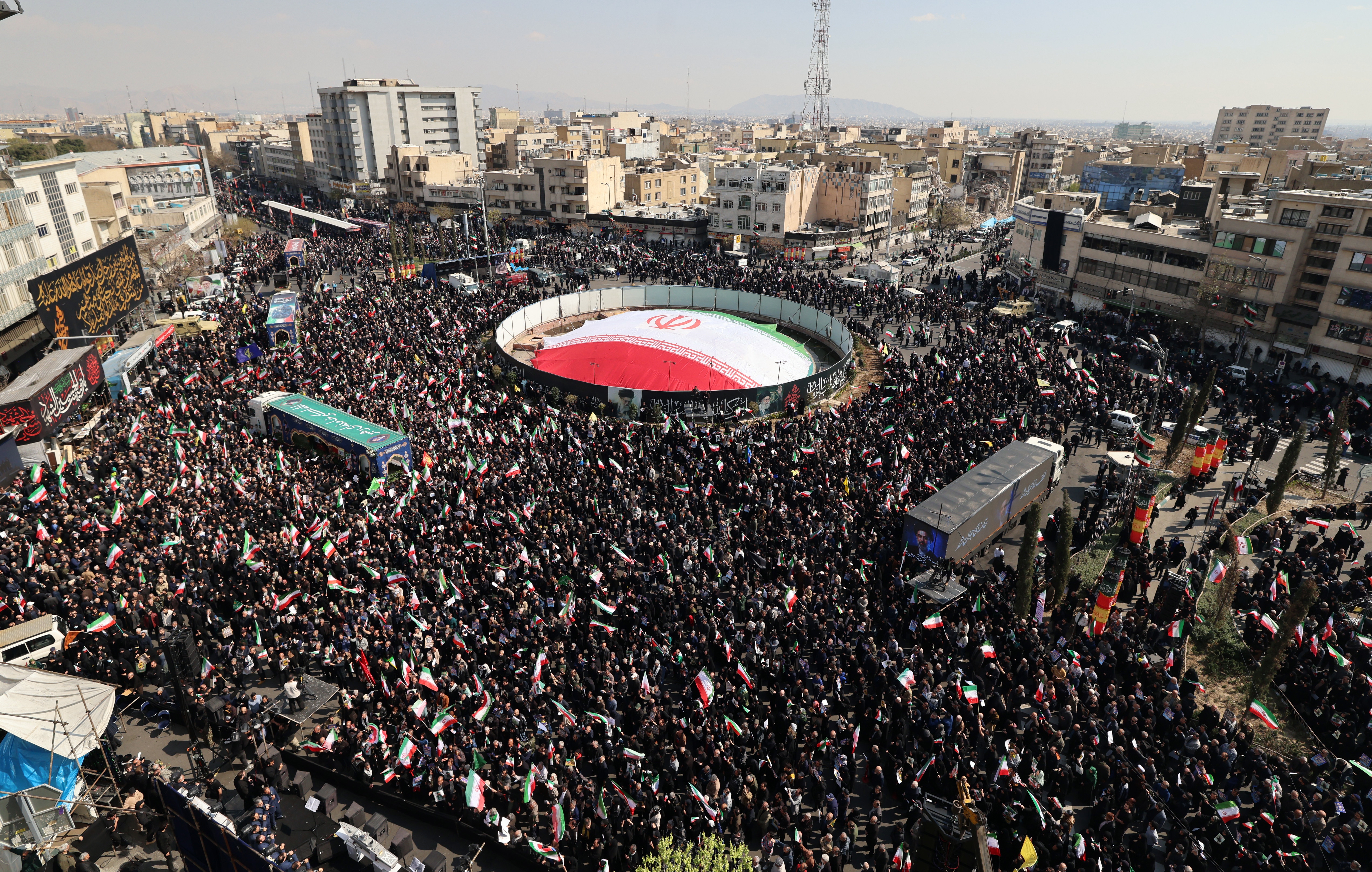 Iranian mourners take part in a funeral procession in Tehran, Iran, 18 March 2026. Thousands gathered in Enghelab Square to honor Ali Larijani, Secretary of the Supreme National Security Council, and Major General Gholamreza Soleimani, head of the Basij paramilitary forces; both were killed in airstrikes on 17 March. The funeral also served as a memorial for the dozens of Iranian sailors killed aboard the Iranian destroyer IRIS Dena, which was sunk by US forces in the Indian Ocean earlier this month. A joint US-Israeli military operation continues to target multiple locations across Iran since 28 February 2026.  EPA/ABEDIN TAHERKENAREH