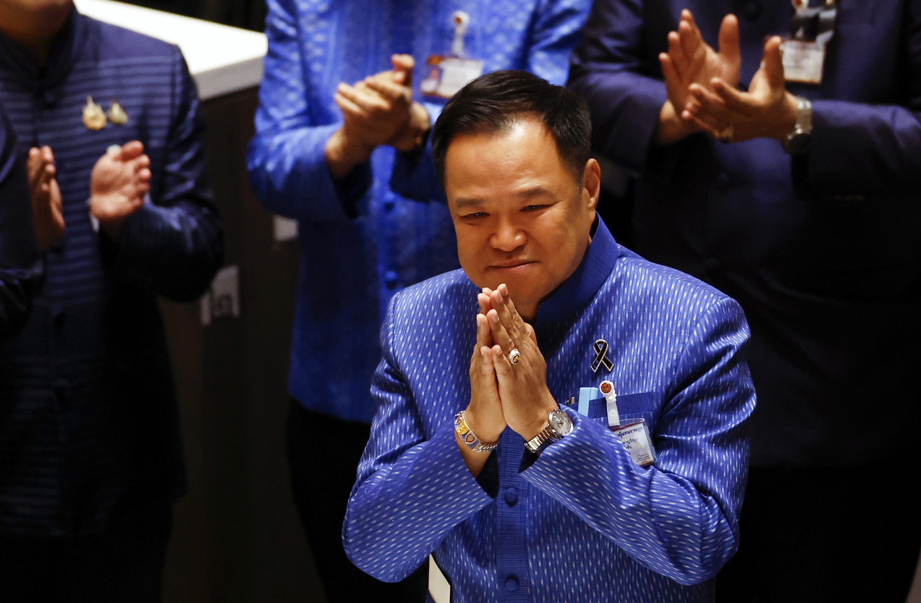 Bhumjaithai Party's leader Anutin Charnvirakul (C) greets lawmakers to thank them after being re-elected as prime minister during a House of Representatives meeting session to vote for a new prime minister at Parliament in Bangkok, Thailand, 19 March 2026. Anutin Charnvirakul, the Bhumjaithai Party leader and current caretaker premier, was re-elected as prime minister after leading his party to win the 08 February general election.  EPA/RUNGROJ YONGRIT