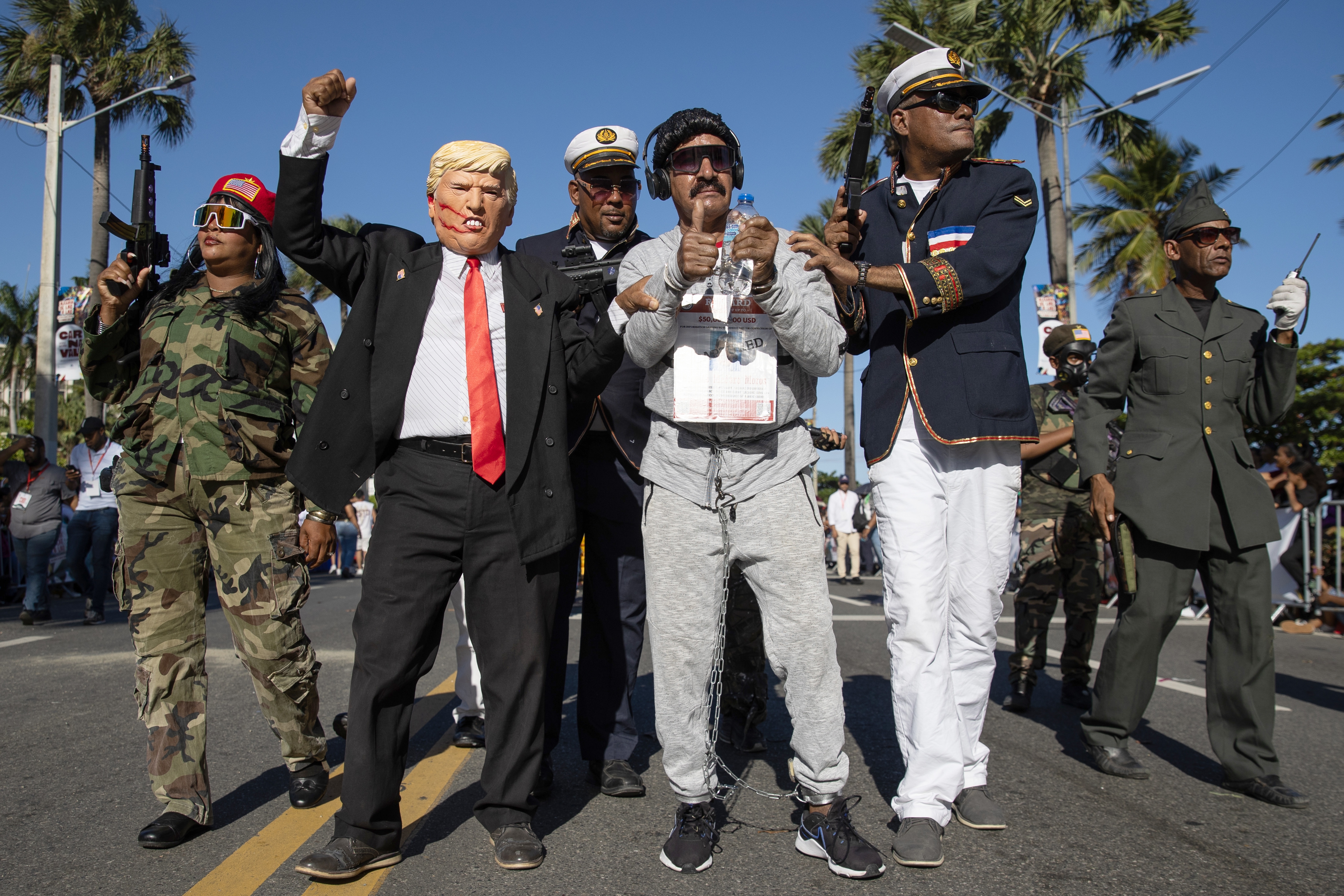 People dressed as US President Donald Trump and former Venezuelan President Nicolas Maduro participate during the National Carnival Parade, in Santo Domingo, Dominican Republic, 15 March 2026. The parade paid tribute to the carnival culture of Puerto Plata and featured around 180 dance troupes.  EPA/ORLANDO BARRIA