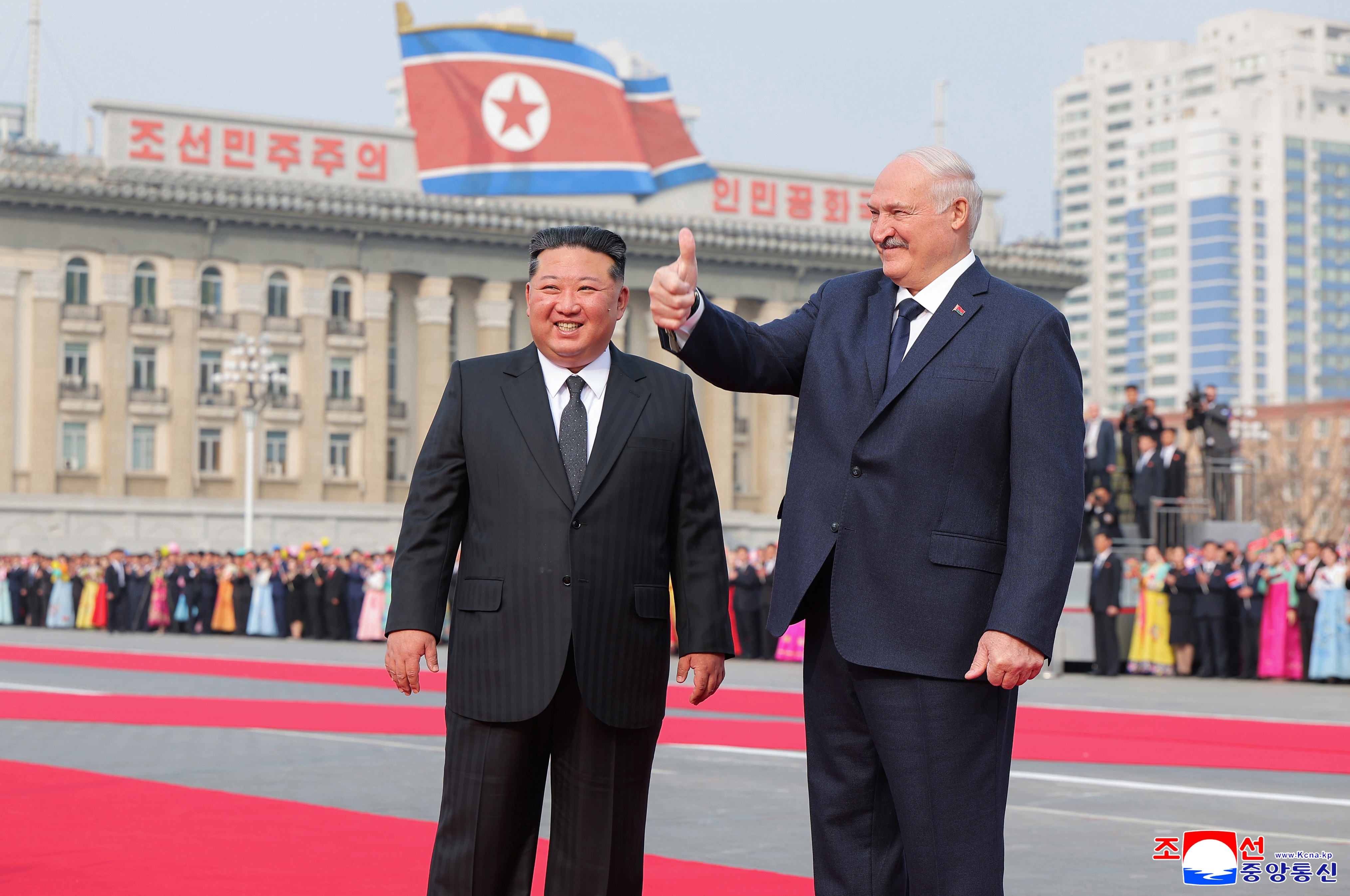 A photo released by the official North Korean Central News Agency (KCNA) shows Belarusian President Alexander Lukashenko (R) gesturing beside North Korean leader Kim Jong Un during a welcome ceremony at Kim Il Sung Square in Pyongyang, North Korea, 25 March 2026 (issued 26 March 2026). Lukashenko is on his first official visit to North Korea.  EPA/KCNA  EDITORIAL USE ONLY