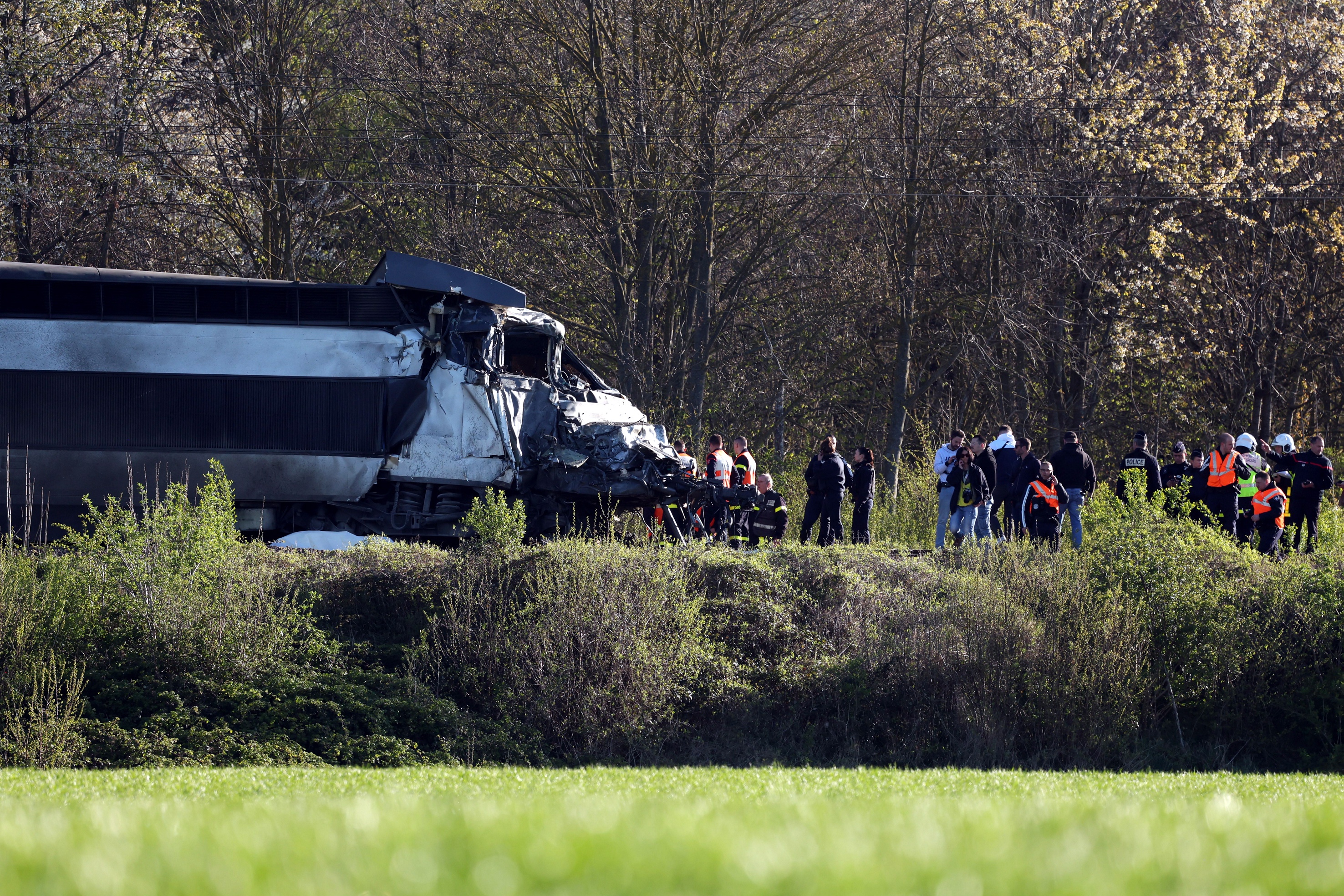 Investigators stand at the site of a collision of a TGV locomotive and a truck near Bully-les-Mines, between Bethune and Lens, in the Pas-de-Calais region, France, 07 April 2026. According to police, the TGV died in the accident.  EPA/MAXPPP/LUDOVIC  MAILLARD FRANCE OUT / BELGIUM OUT EDITORIAL USE ONLY/NO SALES/NO ARCHIVES