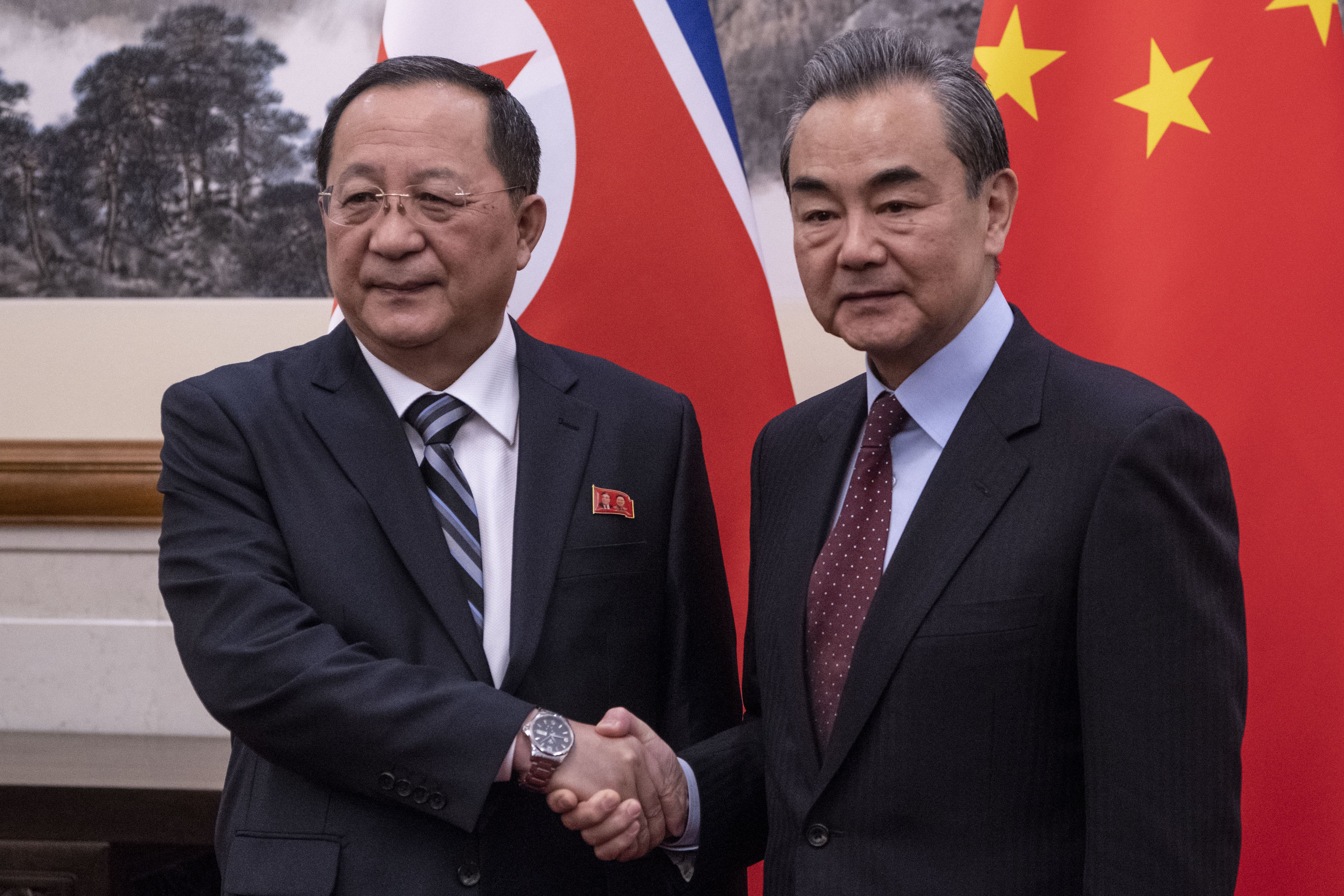 North Korean Foreign Minister Ri Yong Ho (L) and China's Foreign Minister Wang Yi shake hands during a meeting at the Diaoyutai State Guesthouse in Beijing, China, 07 December 2018.  EPA/FRED DUFOUR / POOL