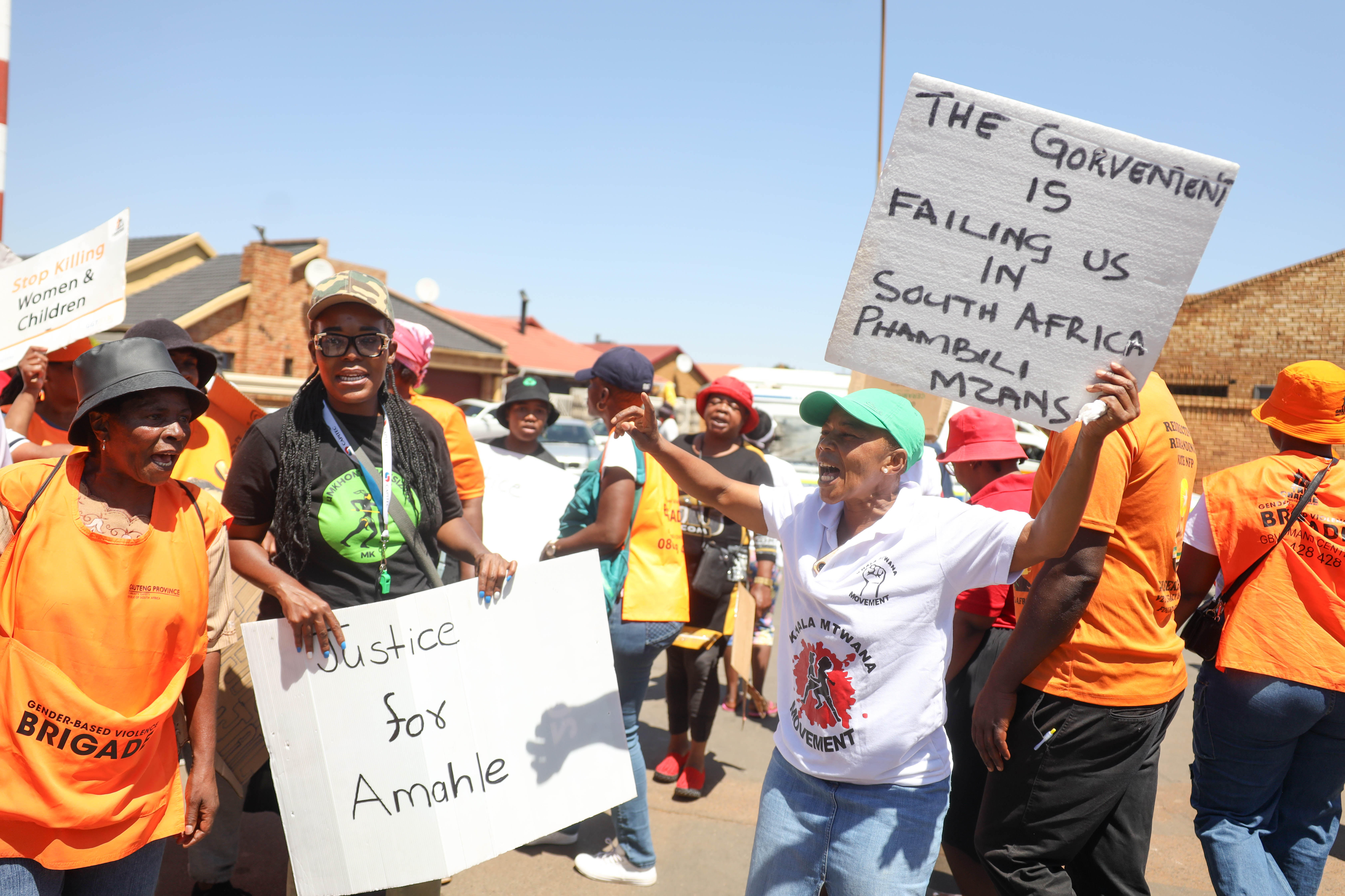 A gender-based violence NGO pickets outside Protea Magistrate’s Court before Pethe Simiao’s bail application on 1 November 2024, in Soweto, South Africa. The suspect is accused of kidnapping, raping and murdering six-year-old Amantle Samane. (Photo: Sharon Seretlo / Gallo Images via Getty Images)