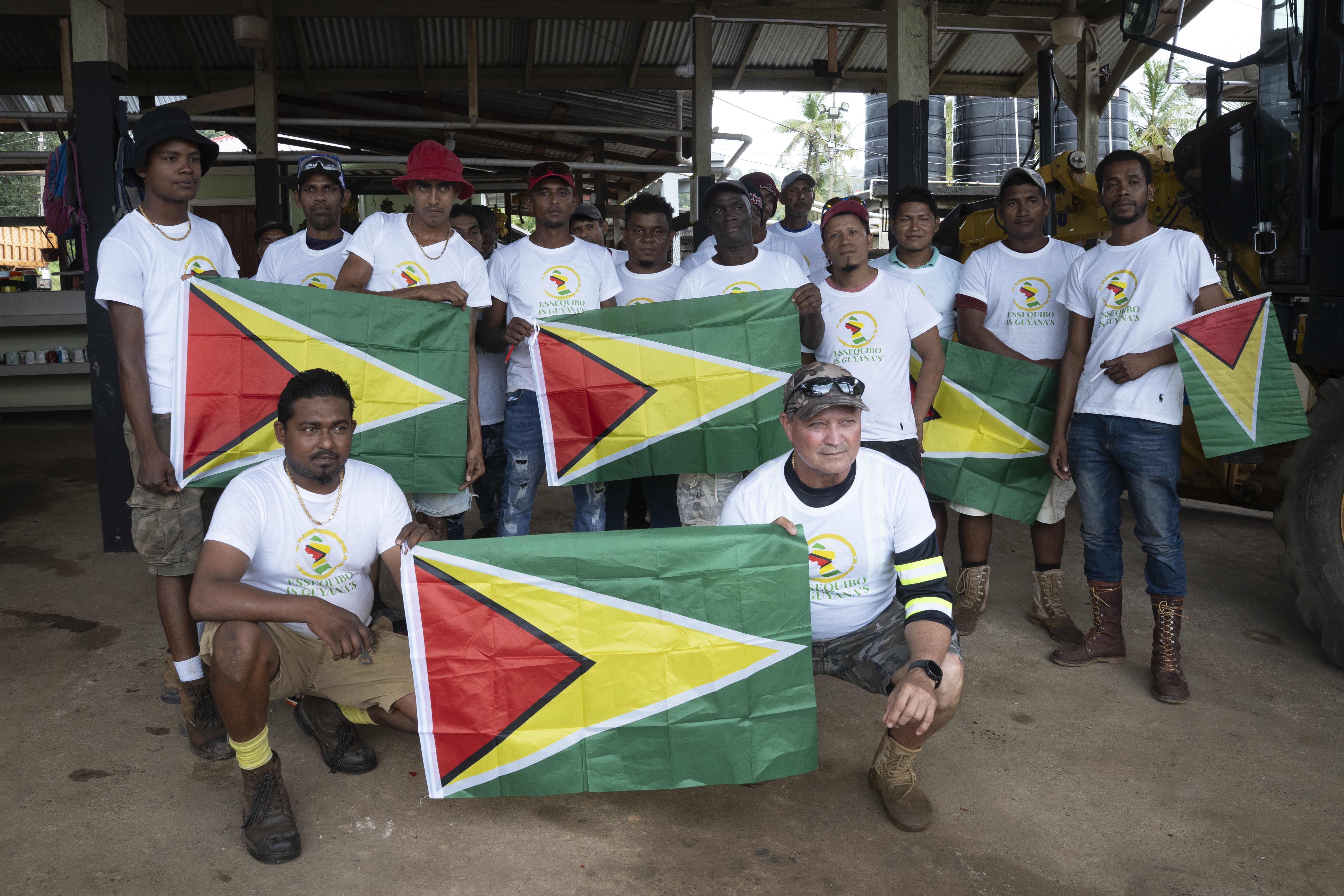 Workers from GV Construction pose with T-shirts bearing the message 'Essequibo is Guyana' and the country's flag in the village of Matthew's Ridge in Essequibo, Guyana, 25 May 2025. Venezuela's claims to Essequibo, a disputed territory administered by neighboring Guyana, are a source of concern for business leaders in the region.  EPA/Nazima Raghubir