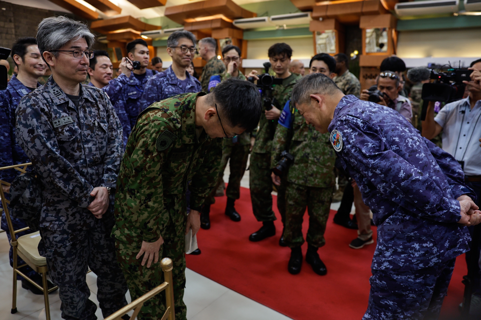 Military officers from Japan greet each other during opening ceremonies of the Philippines-US Exercise Balikatan (Shoulder to Shoulder) held at a military camp in Quezon City, Metro Manila, Philippines, 20 April 2026. The Philippines and US will conduct the 41st iteration of joint military exercises in various locations in the Philippines from 20 April to 08 May, and will be joined by partner delegations from Australia, Canada, France, Japan and New Zealand.  EPA/ROLEX DELA PENA