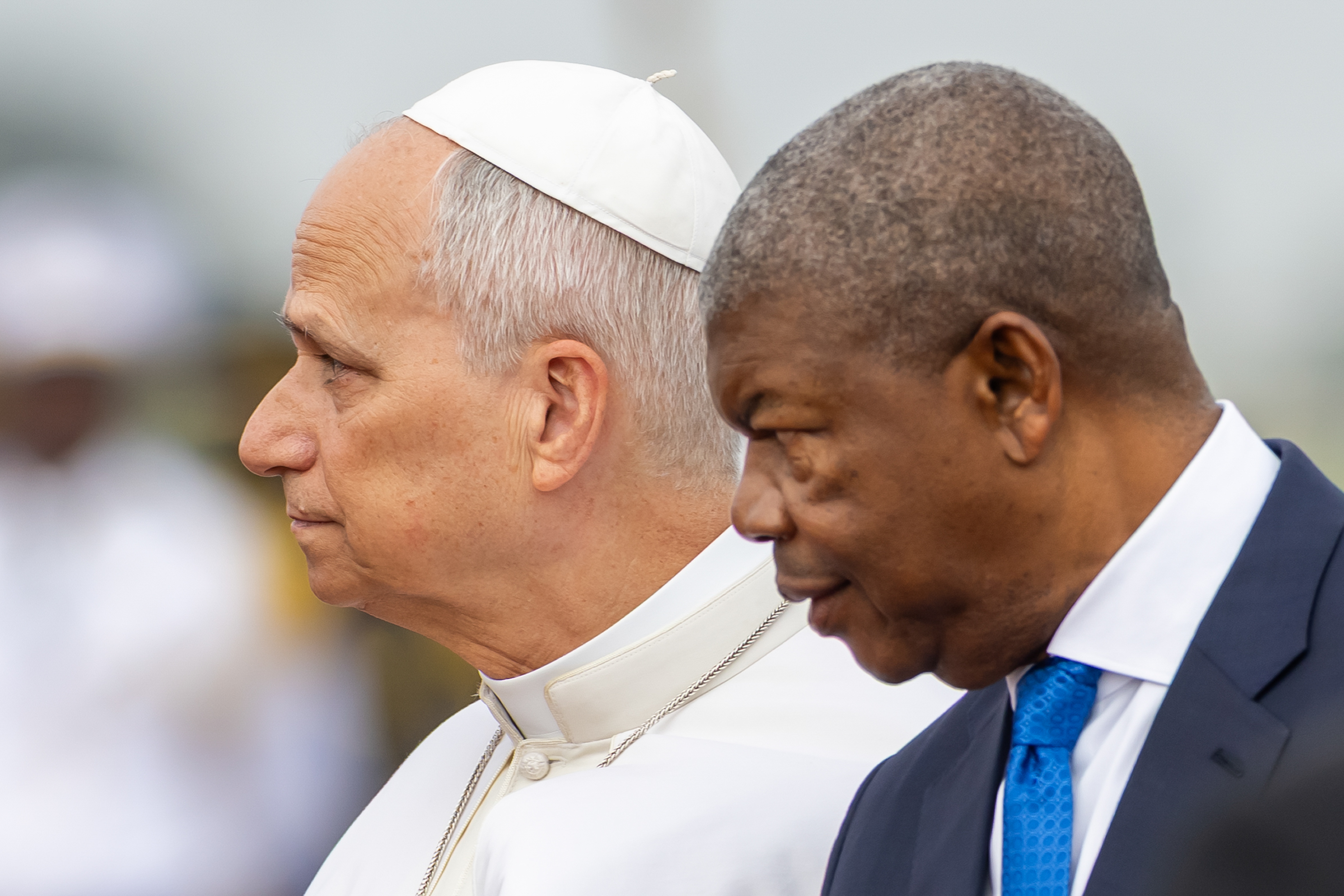 Pope Leo XIV (L) and Angolan President Joao Lourenco (R) arrive for the farewell ceremony before the pope embarks the papal plane for Equatorial Guinea at Quatro de Fevereiro International Airport in Luanda, Angola, 21 April 2026. The pope is on an eleven-day apostolic journey to Africa, with stops in Algeria, Cameroon, Angola, and Equatorial Guinea.  EPA/JOSE SENA GOULAO
