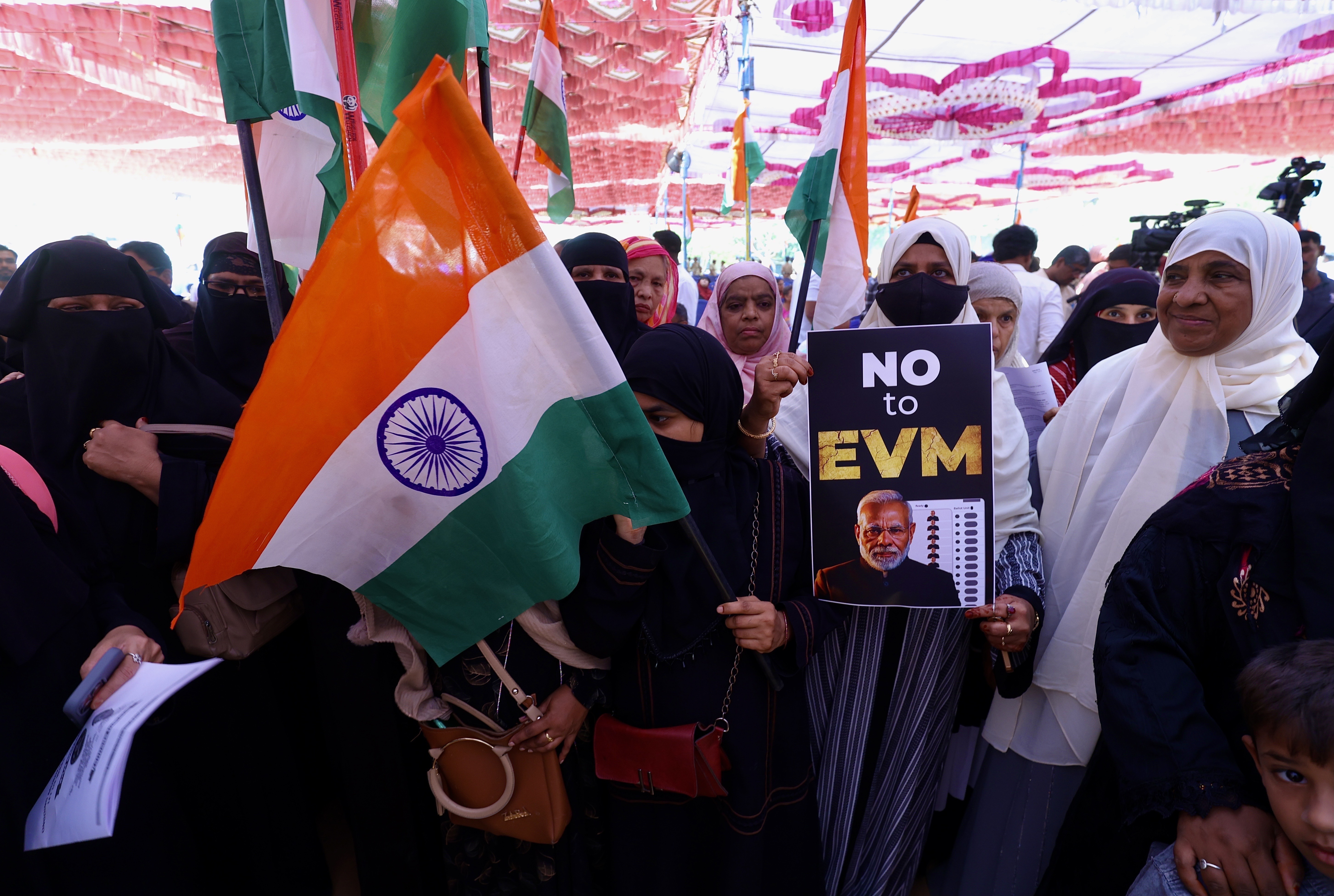Members of various non-governmental organizations and social activists hold placards against the BJP-led Narendra Modi government over voter-list revisions during a protest in Bangalore, India, 23 April 2026. The Election Commission of India recently announced the Special Intensive Revision (SIR) process to thoroughly update and clean electoral rolls across parts of the country. SIR is meant to improve election accuracy, but its impact depends heavily on how carefully and transparently it is implemented, and opposition parties claim the process has caused millions of people to lose their names on the voter lists and could disenfranchise minorities and the poor.  EPA/JAGADEESH NV