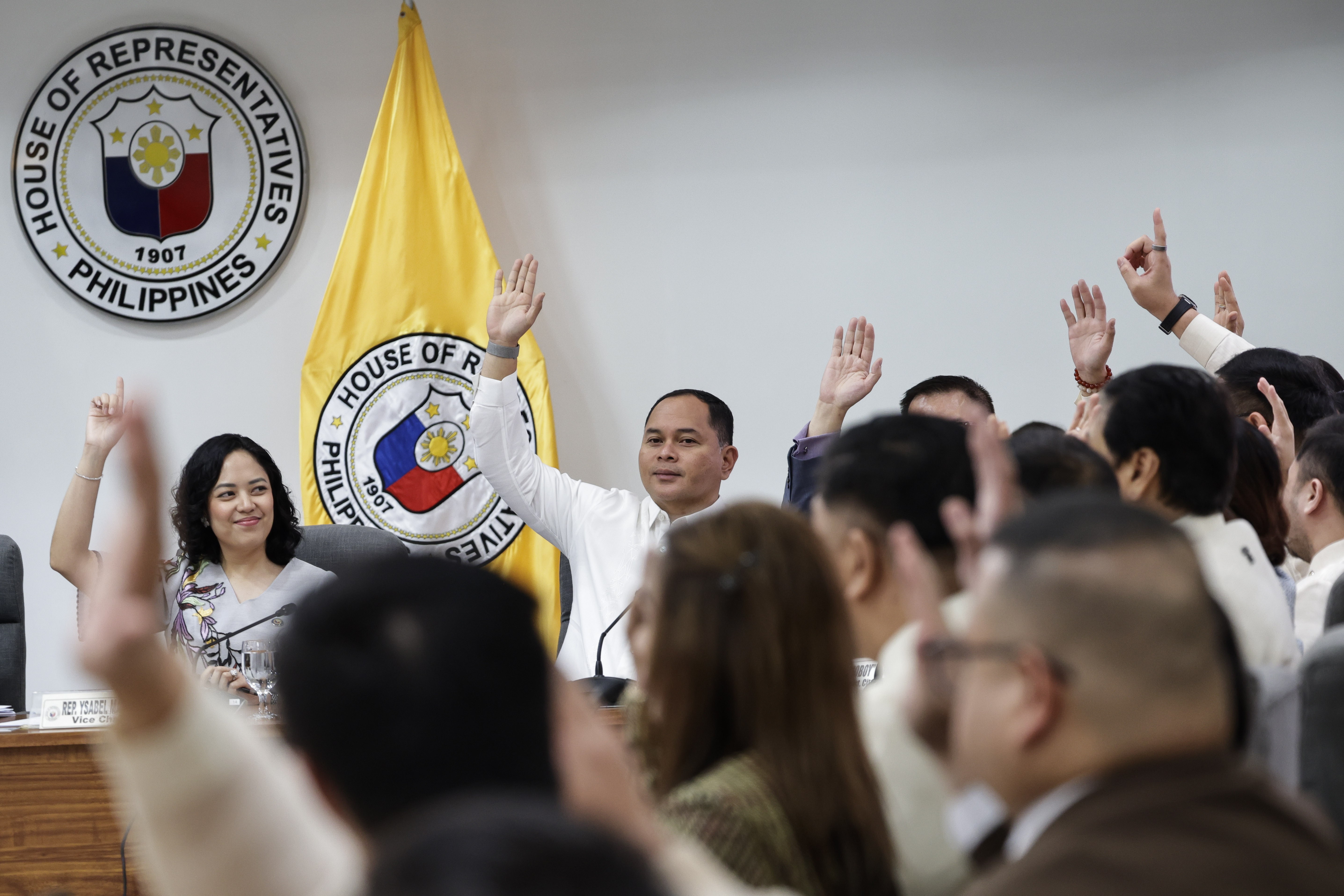 Members of the House of Representatives Justice Committee raise their hands to vote during a committee hearing in Quezon City, Metro Manila, Philippines 04 May 2026. The Justice Committee voted unanimously to approve a report with attached resolution setting forth articles of impeachment against Philippine Vice-President Sara Duterte. The latest vote is expected to elevate proceedings to the plenary of the House of Representatives.  EPA/ROLEX DELA PENA