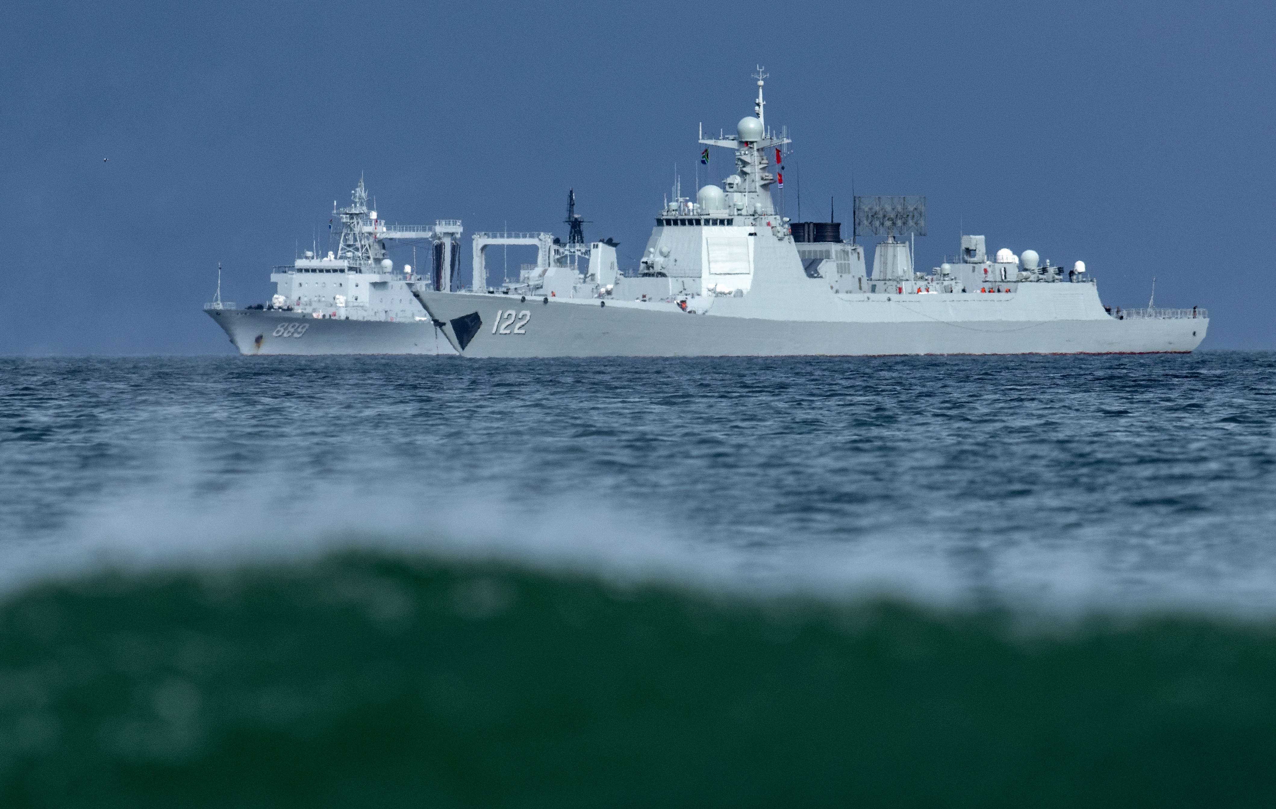 Chinese People's Liberation Army (PLA) naval vessels Type 052DL guided-missile destroyer? Tangshan (D122), R, and the Type 903A replenishment ship Taihu?(K889), L, sail in False Bay, outside Naval Base Simonstown, Cape Town, South Africa, 06 January 2026. South Africa will host a naval exercise from 09 to 16 January 2026 together with several Chinese, Russian, and Iranian naval vessels. China will lead the exercise, titled Will for Peace, according to the South African National Defence Force (SANDF).  EPA/BRENTON GEACH