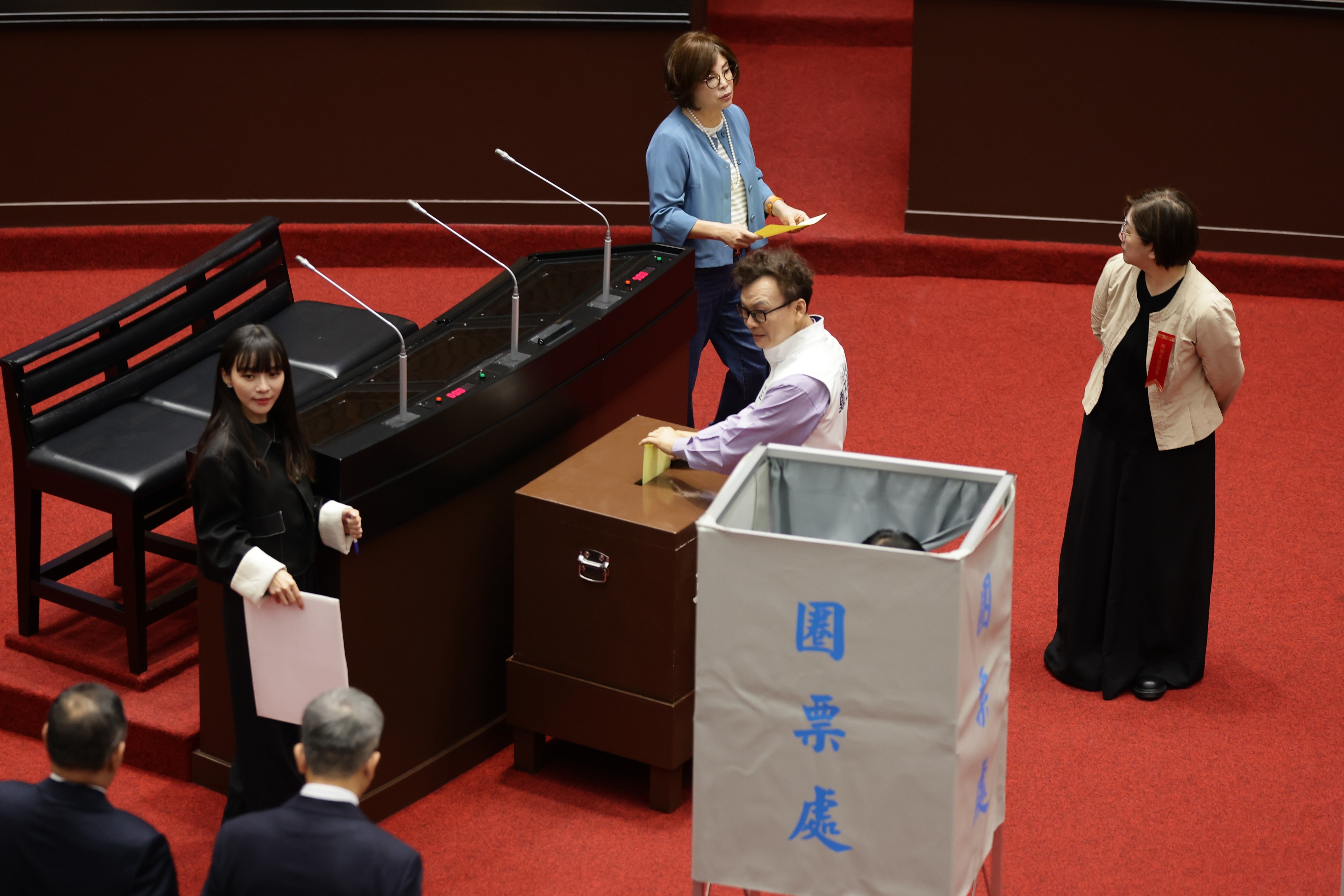 Taiwanese lawmakers cast their vote on the impeachment of Taiwan President Lai Ching-te, inside the Legislative Yuan building in Taipei, Taiwan, 19 May 2026. An impeachment initiated by the opposition against President Lai Ching-te failed in the Legislature on Tuesday. The vote was 56-50 in favor, but it missed the 76-vote threshold required to advance. The KMT and TPP filed the motion in December 2025 after Lai declined to promulgate a bill boosting local governments' share of tax revenue. EPA/RITCHIE B. TONGO
