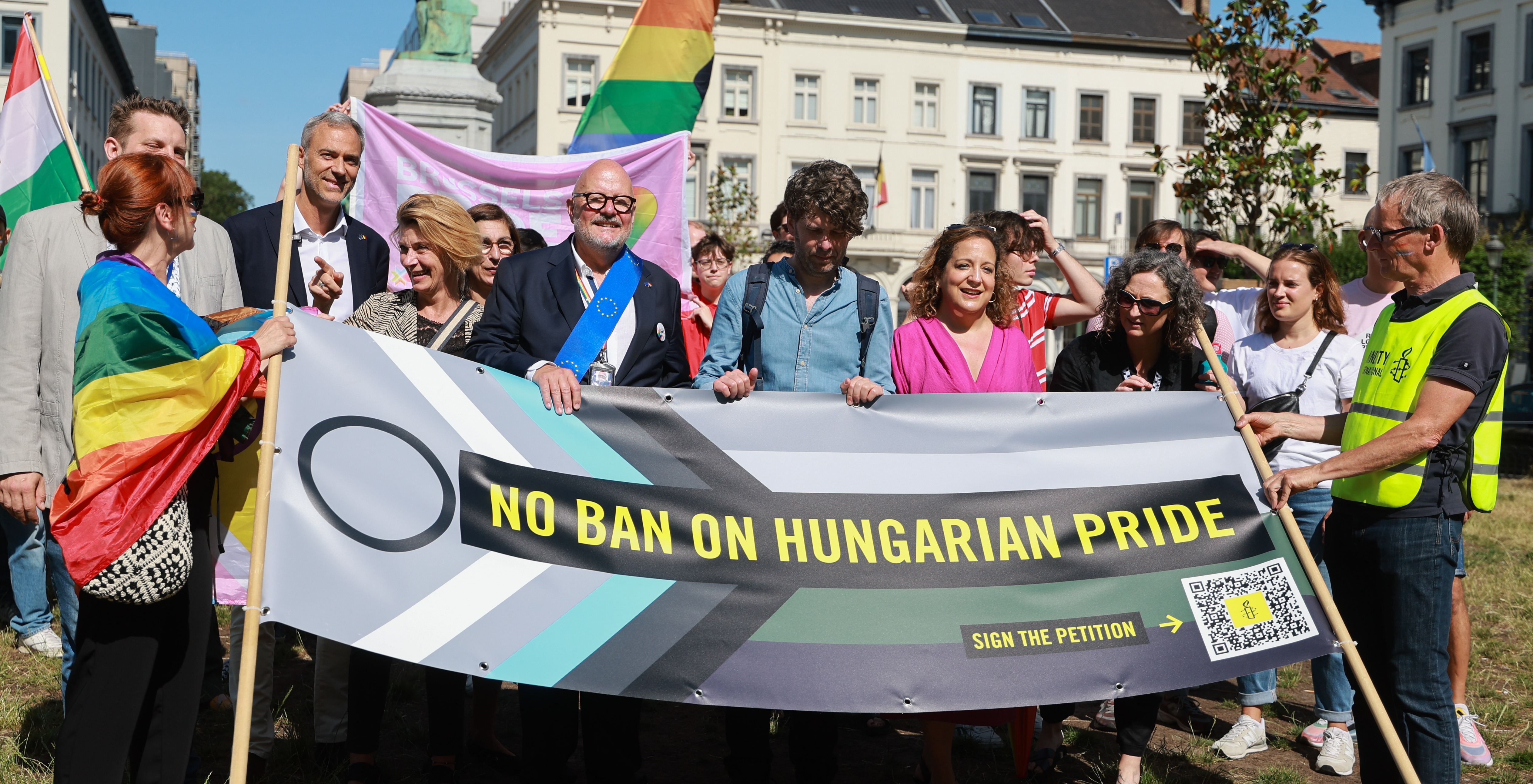 Members of the European Parliament, including French MEP Raphael Glucksmann, Luxembourger Marc Angel, and Spanish leader of the Progressive Alliance of Socialists and Democrats (S&D), Iratxe Garcia Perez, pose with Amnesty International activists during a ‘Mini Pride’ demonstration against Hungary’s Pride ban in front of the European Parliament and the Hungarian representation in Brussels, Belgium, 25 June 2025. Over 14,000 people in Belgium and 75,000 worldwide have signed Amnesty International's petition calling on Hungarian authorities to allow Budapest Pride to take place without fear or violence. The 30th edition, scheduled for 28 June, is at risk of being banned under a new law passed in March that allows authorities to prohibit the march, fine participants, prosecute organizers, and use facial recognition to identify attendees. EPA/OLIVIER HOSLET