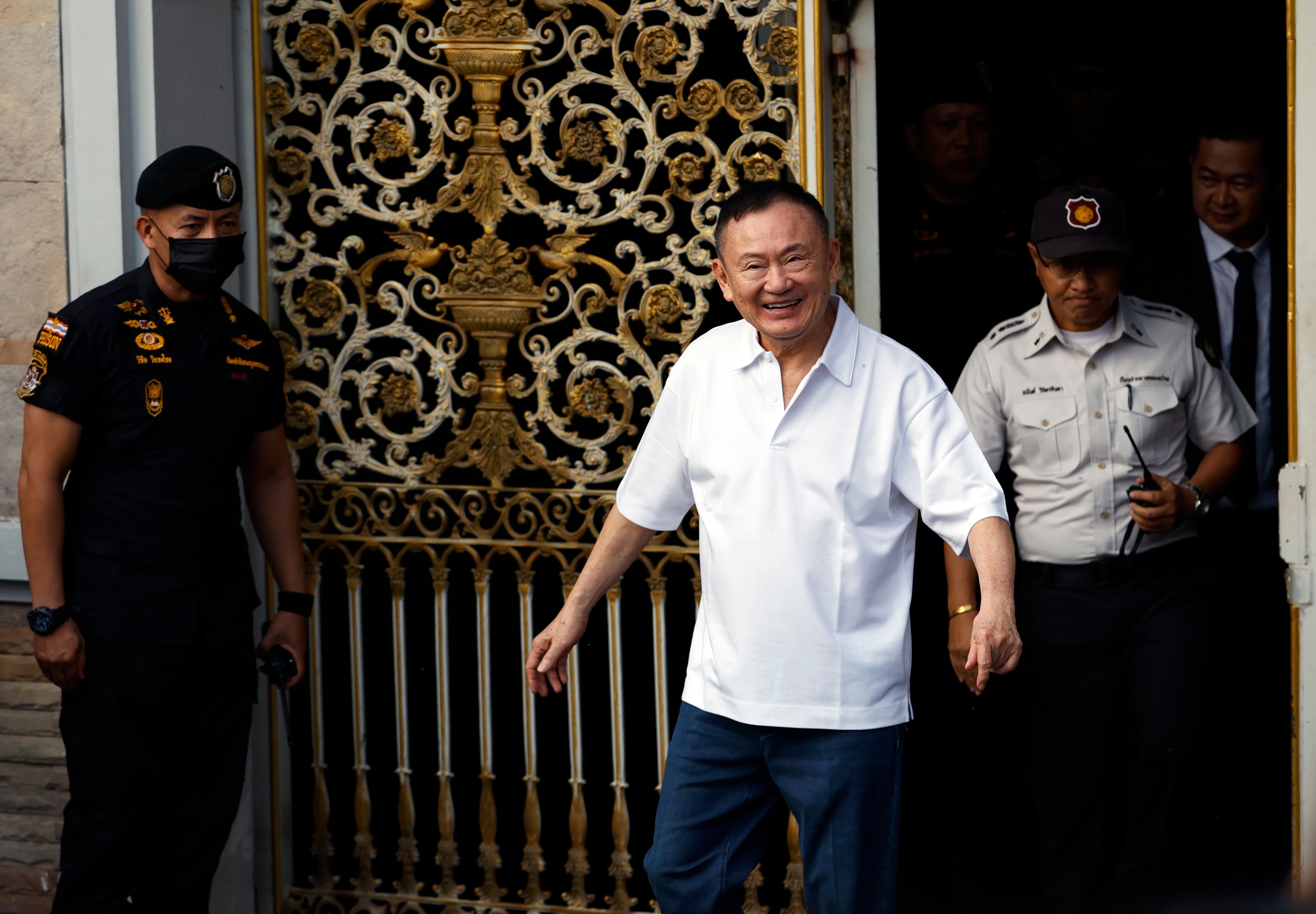 Imprisoned former Thai Prime Minister Thaksin Shinawatra (C) walks free from prison after being released on parole at Klong Prem Central Prison in Bangkok, Thailand, 11 May 2026. Former Thai Prime Minister Thaksin Shinawatra is being released on parole under the condition that he wears an electronic monitoring device until the end of his sentence in September 2026 after serving eight months of his one-year jail term for corruption and abuse of power, according to the Justice Ministry. EPA/RUNGROJ YONGRIT