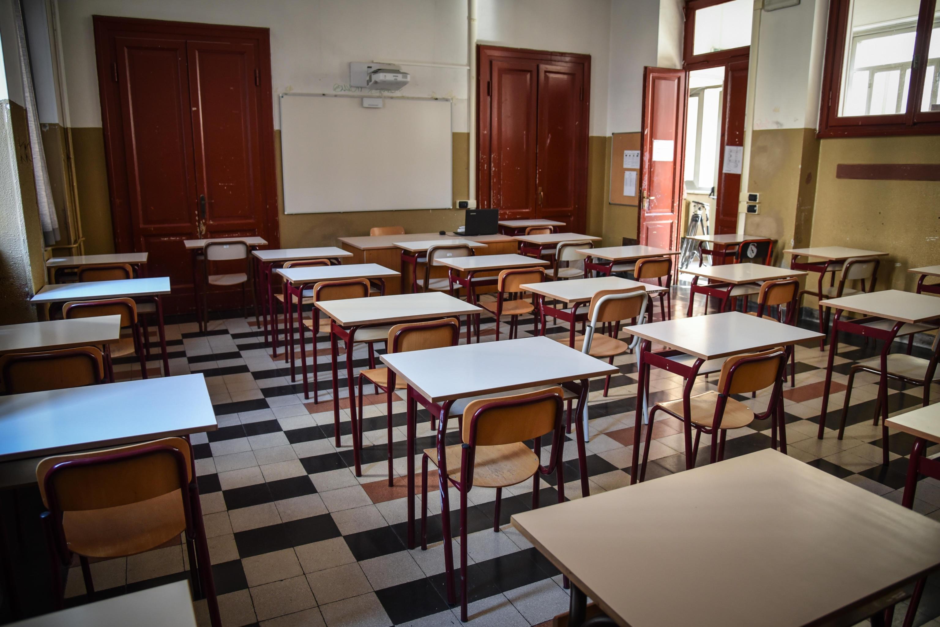  Individual desks have been positioned for social distancing in a classroom, as preparations for the start of the school year with Covid-19 anti-contagion regulations are underway at the Parini high school, in Milan, Italy, 25 August 2020. The new school year 2020/2021 is scheduled to begin on 14 September. EPA/MATTEO CORNER