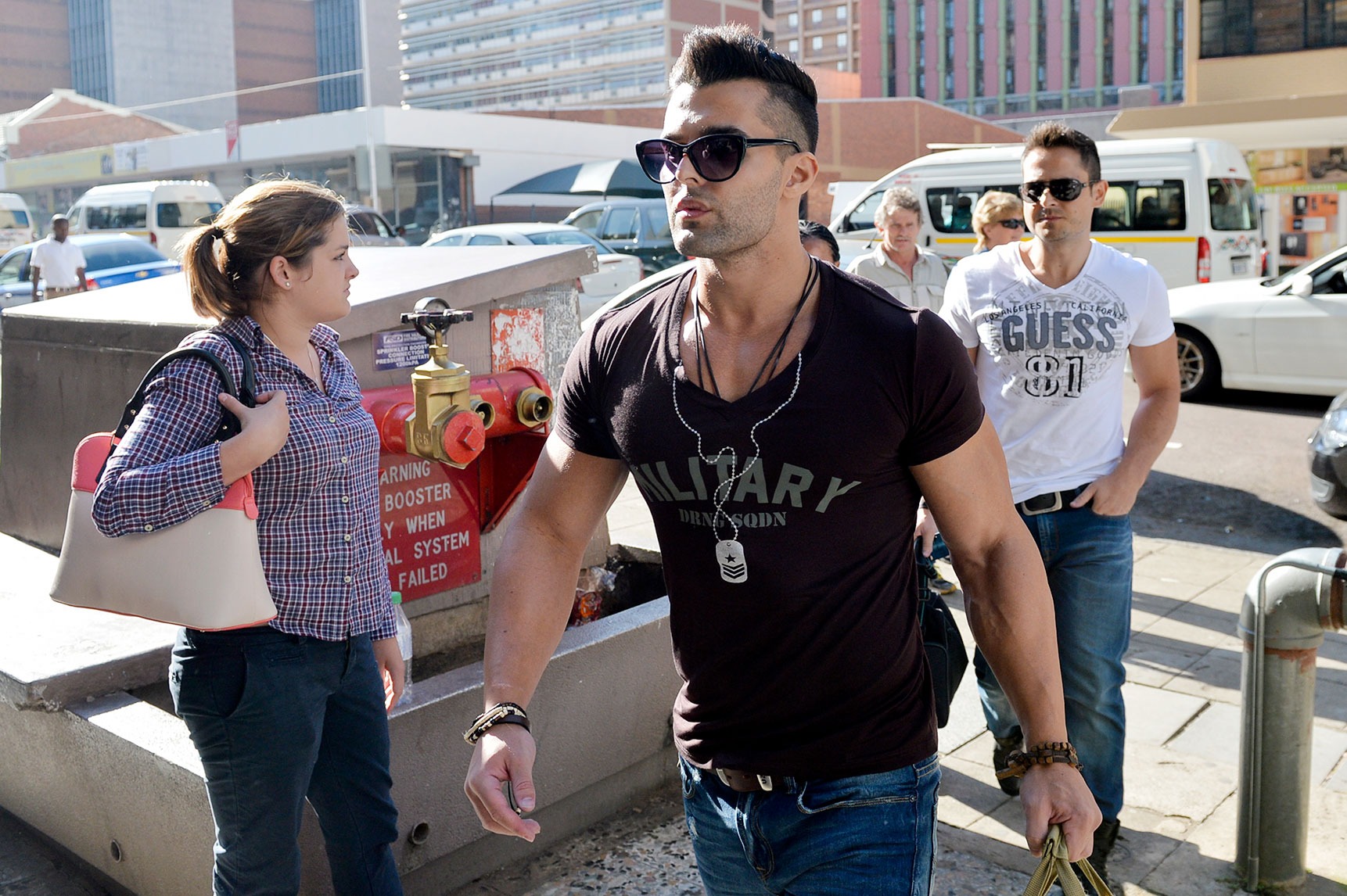 Christoff Becker and Frikkie du Preez (rear right)  arrive at the Department of Correctional Services on 11  February 2014 in Pretoria. The Waterkloof Four were released on parole after serving half their sentences. Christoff Becker, Reinach Tiedt, Gert van Schalkwyk and Frikkie du Preez were each sentenced to 12 years in prison for killing a homeless man in 2001. (Photo: Gallo Images / Foto24 / Herman Verwey)
