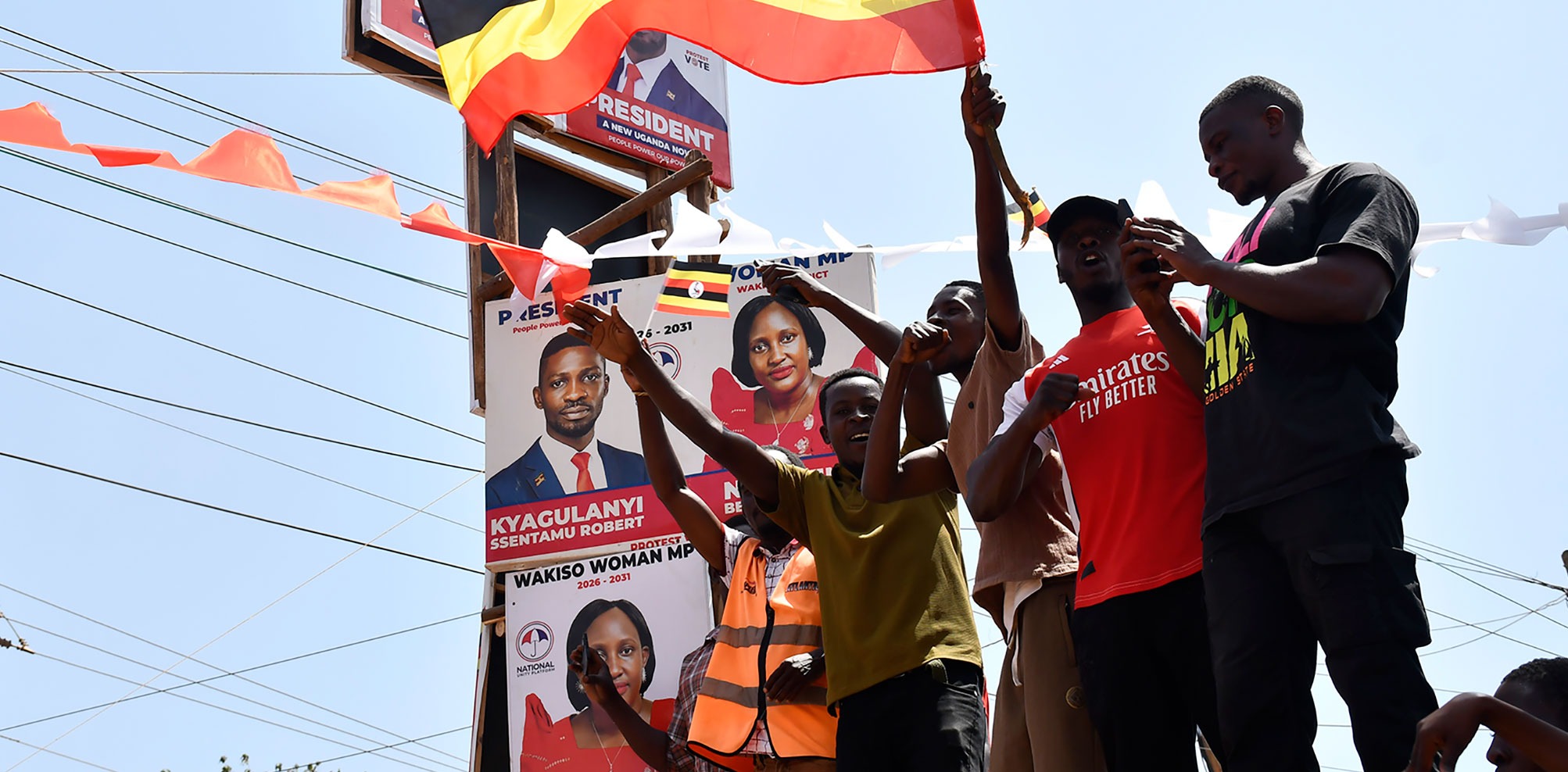 Supporters of Uganda's opposition National Unity Platform leader, Bobi Wine, make their way to Wine's rally in Katogo, Uganda, on 1 December.  (Photo: Isaac Kasamani / EPA) 