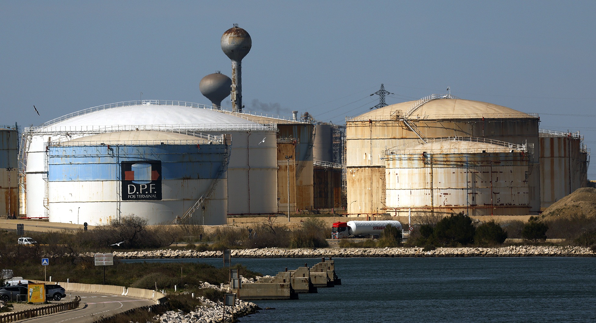 A truck leaves the Depots Petroliers de Fos fuel depot and oil hub in Fos-sur-Mer, France, on 12 March. On 11 March, the members of the International Energy Agency unlocked 400 million barrels of oil from their reserves in response to rising oil prices brought on by the Iran conflict. (Photo: Guillame Horcajuelo / EPA)