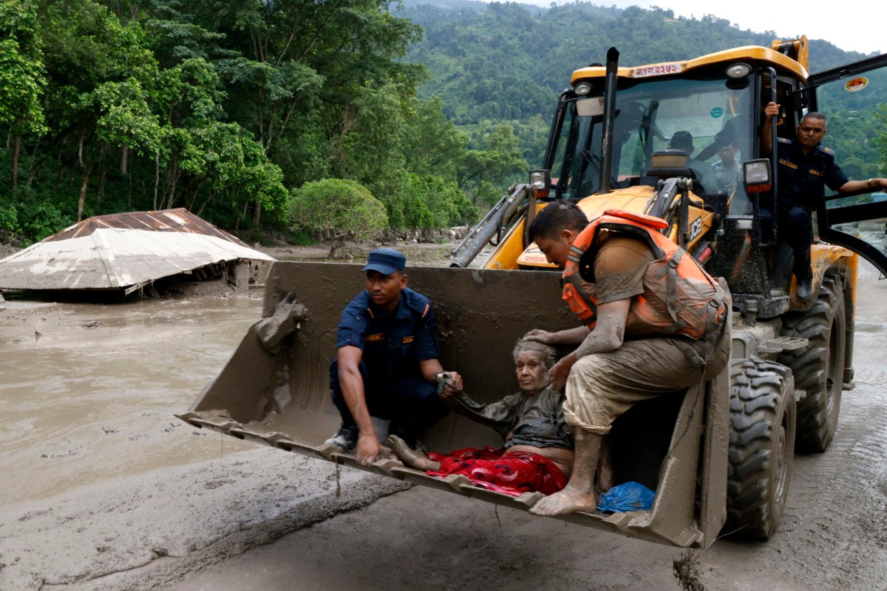 Flash floods and mudslides kill at least 8–22 and leave hundreds missing near Nepal-Tibet border