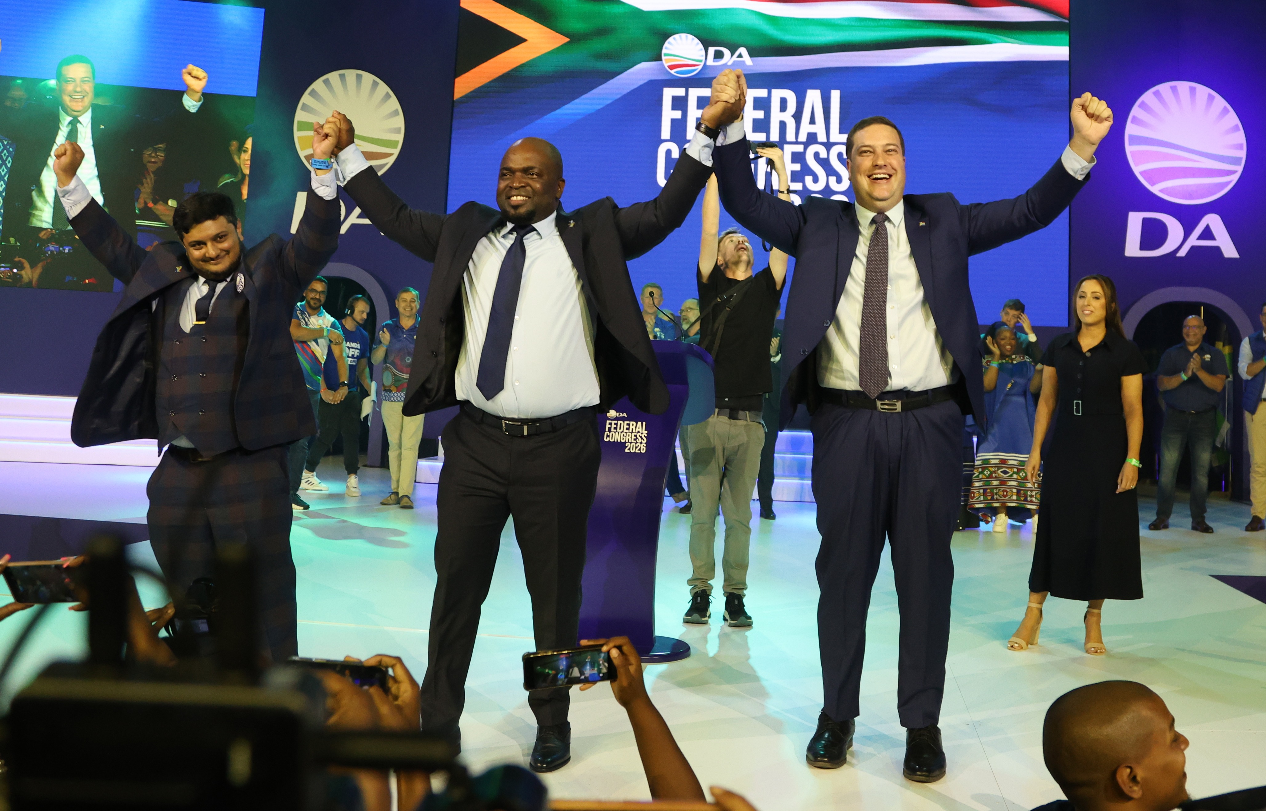 Ashor Sarupen, Solly Msimanga and Geordin Hill-Lewis celebrate during the DA Federal Congress 2026 on Sunday, 12 April in Johannesburg. (Photo: Felix Dlangamandla)