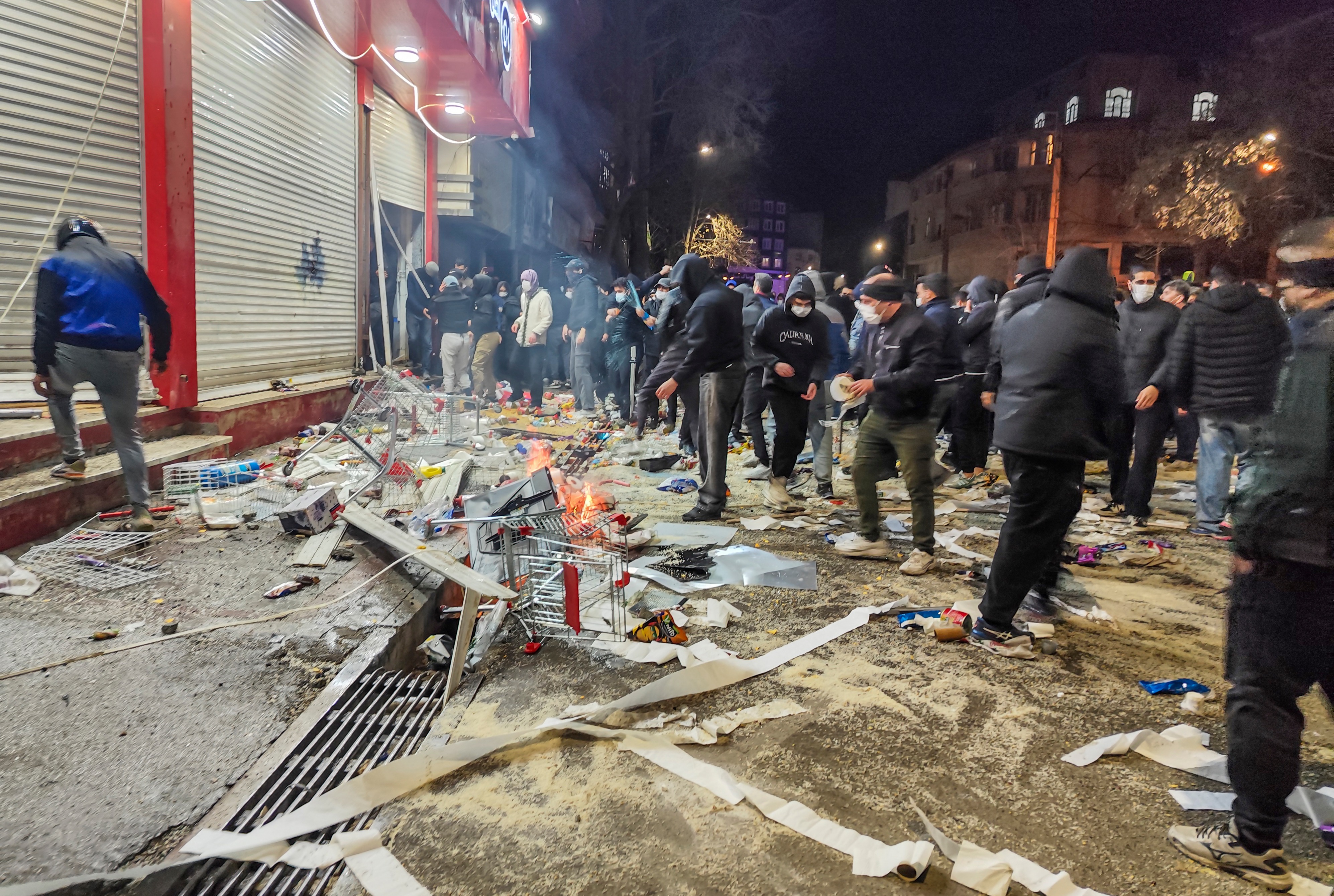 Iranians gather while blocking a street during a protest in Kermanshah, Iran, on 8 January 2026. The nationwide protests began in Tehran’s Grand Bazaar against failing economic policies in late December. (Photo: Kamran / Middle East Images / AFP)