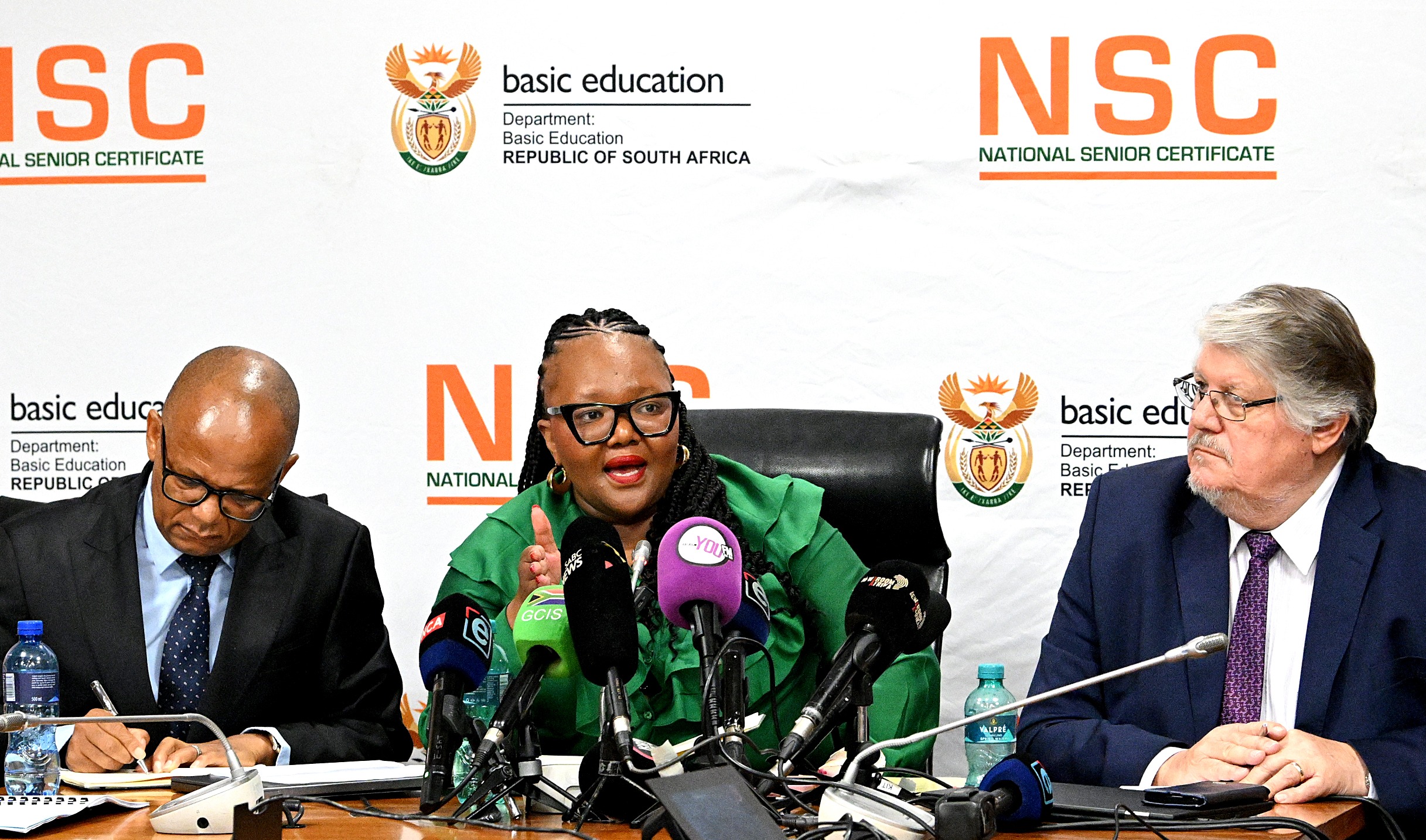 Minister of Basic Education Siviwe Gwarube — flanked by Professor Chika Sehoole (left) and Brian Schreuder  who led the National Investigative Task Team probing the NSC exam leak — briefs the media to formally release the findings of the task team’s interim report in Pretoria on 9 January 2026 . (Photo: Lefty Shivambu / Gallo Images)