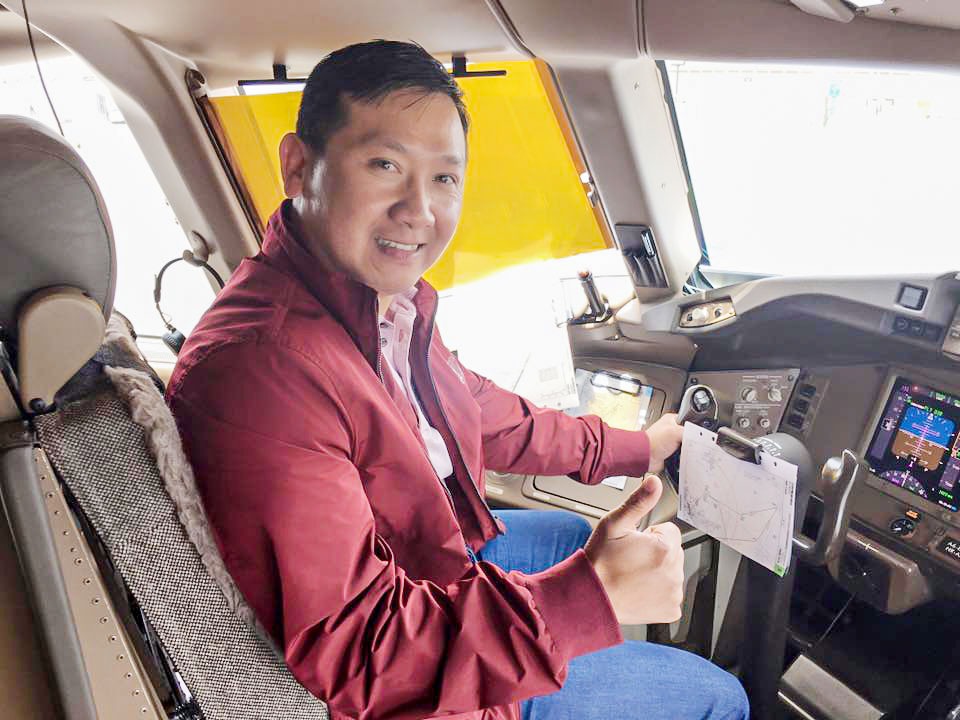 Huy Bao Tran seated in the cockpit of a plane that transported wildlife from South Africa to Vinh Pearl Safari Park, on Phu Quoc island in Vietnam. (Photo: Facebook / Ben Tran)