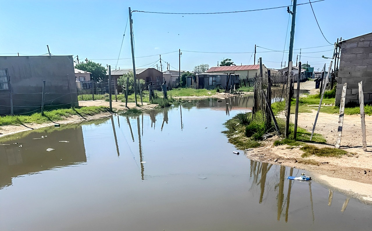 Sewage from a blocked manhole flows down a street in Motherwell, Nelson Mandela Bay. (Photo: Supplied / Thanduxolo Doda)