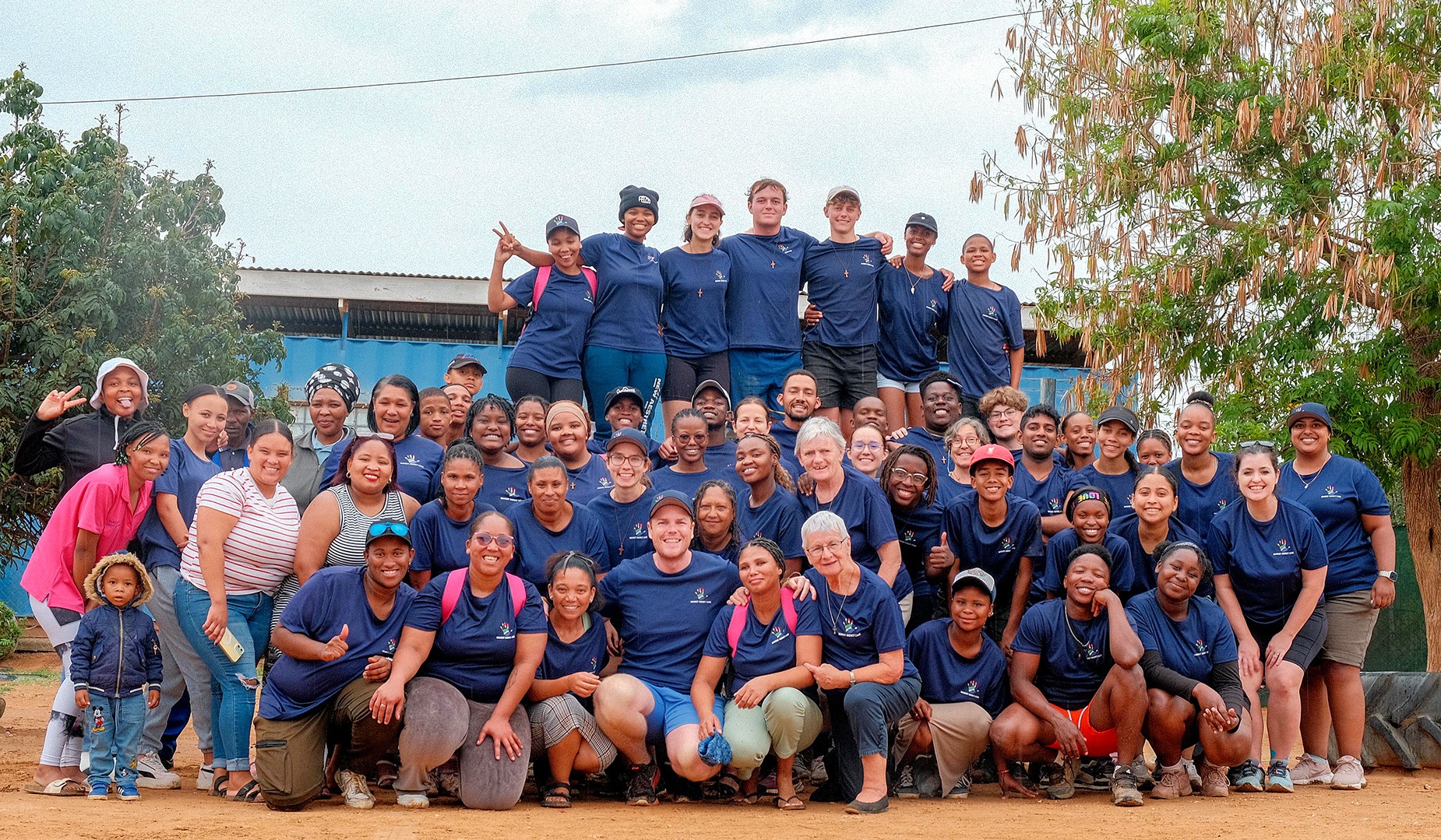 Volunteers, staff and directors at Marist Mercy Care (Place of Mercy and Hope and Lwazi Educare Centre) in Addo, Eastern Cape, after distributing 1,000 essential care parcels containing basic hygiene items and fortified porridge to children in need this holiday season. (Photo: Supplied / Jason Grieve)