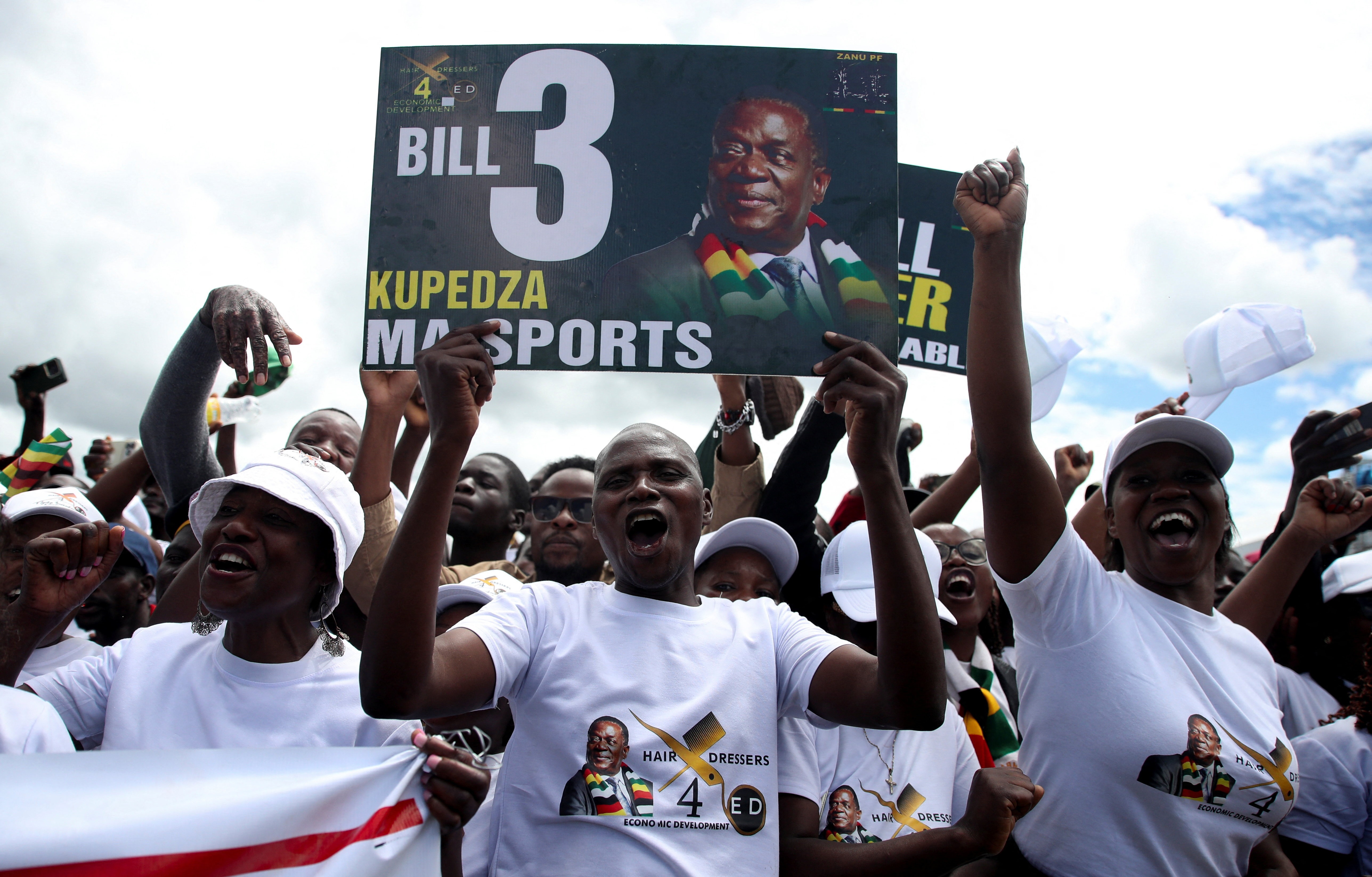 Supporters of Zimbabwe's President Emmerson Mnangagwa react as he arrives to address National Youth Day celebrations at the Igava Training Centre in Marondera on 21 February. (Photo: Philimon Bulawayo / Reuters)