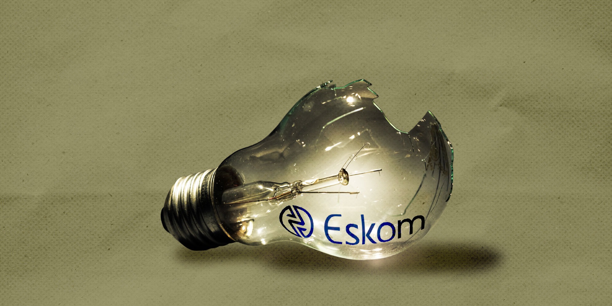 Illustrative image: Light bulb. (Photo: iStock) | Eskom logo. (Image: Wikicommons) | (By Daniella Lee Ming Yesca) 