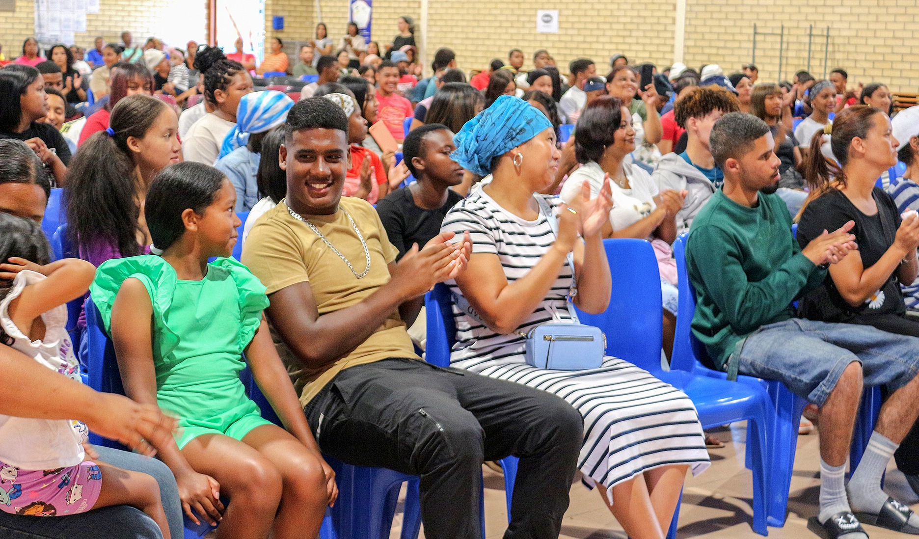 The Lavender Hill High School matric class of 2025 gathers in the school hall with their families before the handover of National Senior Certificate exam results on 13 January 2026. (Photo: Tamsin Metelerkamp)